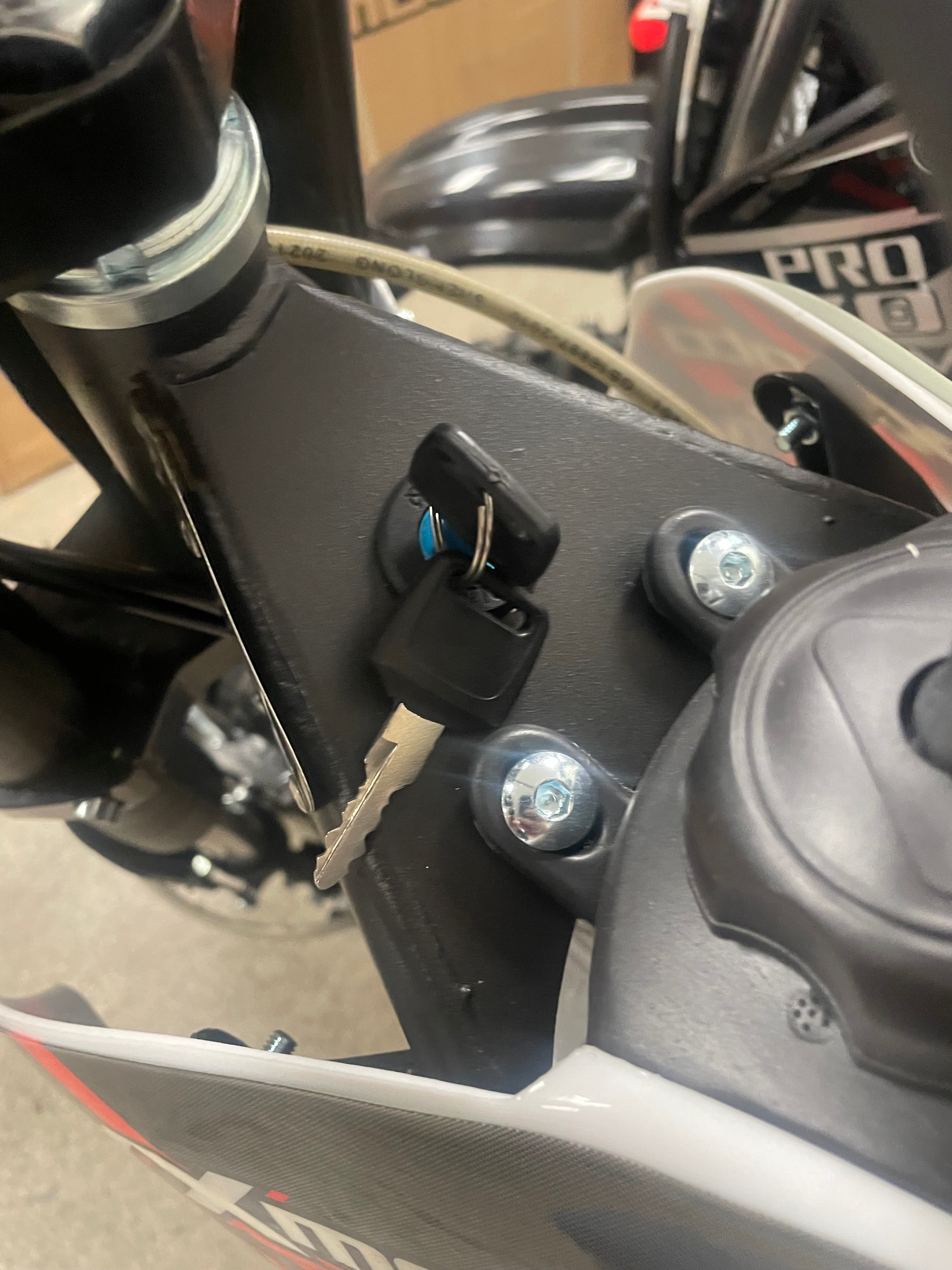 syxmoto 60cc dirt bike keys inserted in ignition