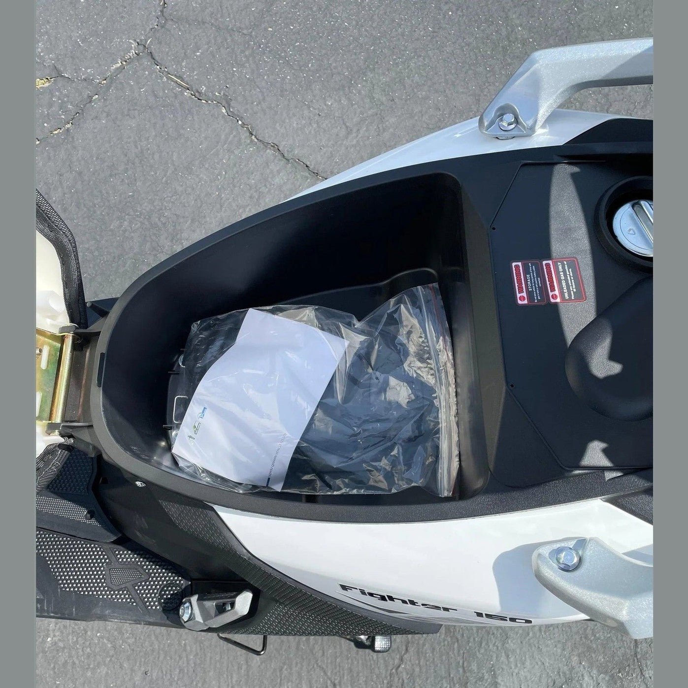 150cc scooter underseat storage compartment open view
