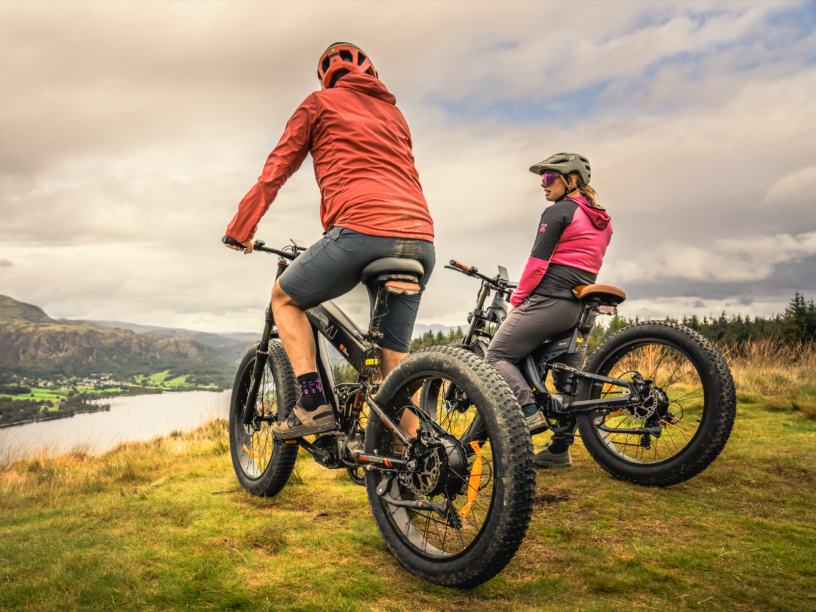 Two riders on Freesky fat tire e-bikes overlooking lake