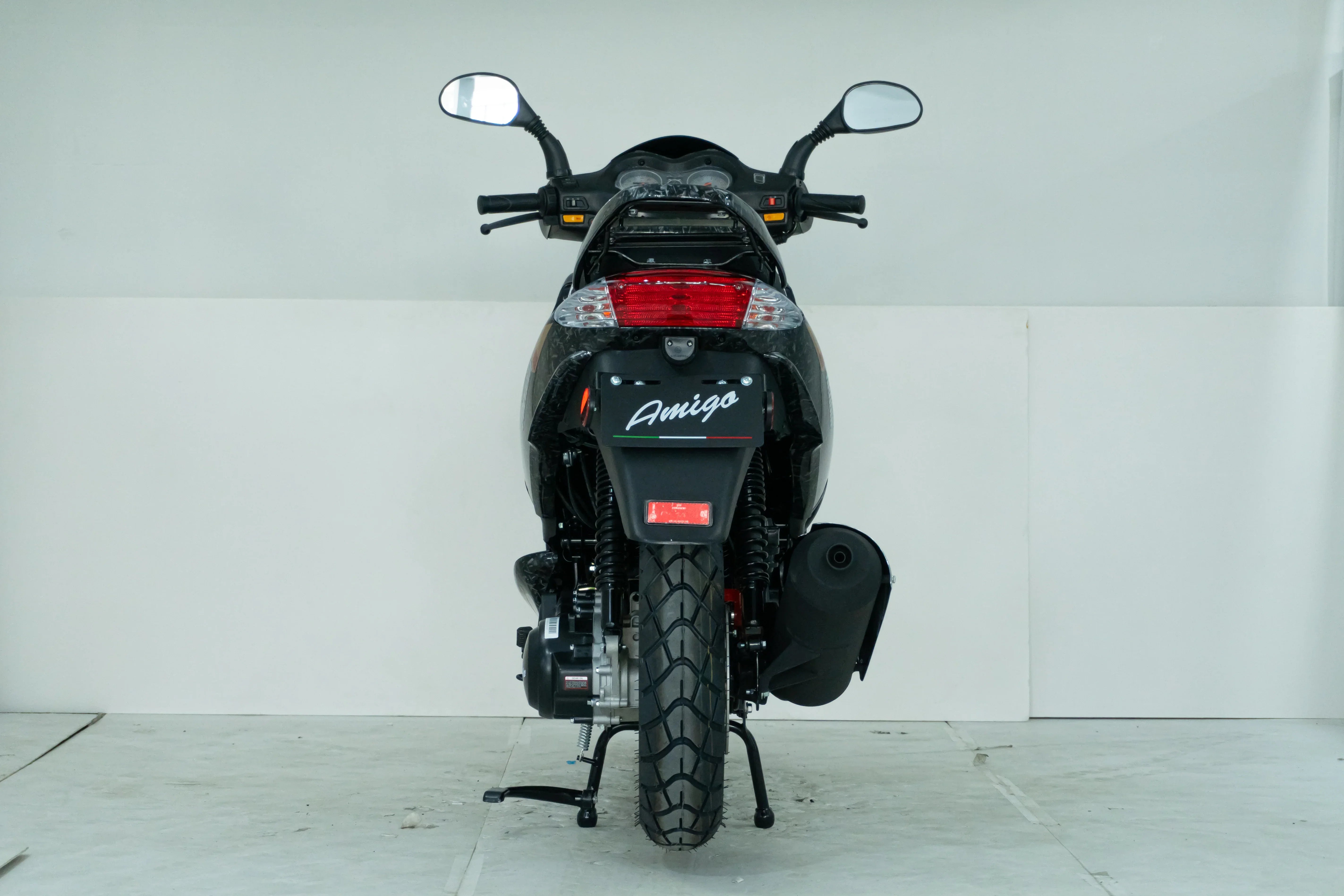 Black Amigo motorcycle rear view with dual mirrors and taillight, ideal for powersports enthusiasts.