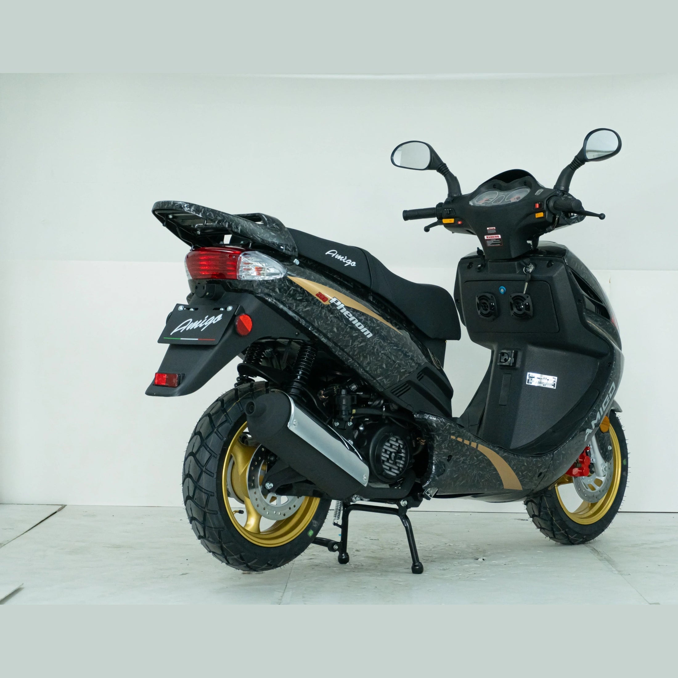 Black Amigo Phenom scooter with gold wheels and rear view mirrors on white background