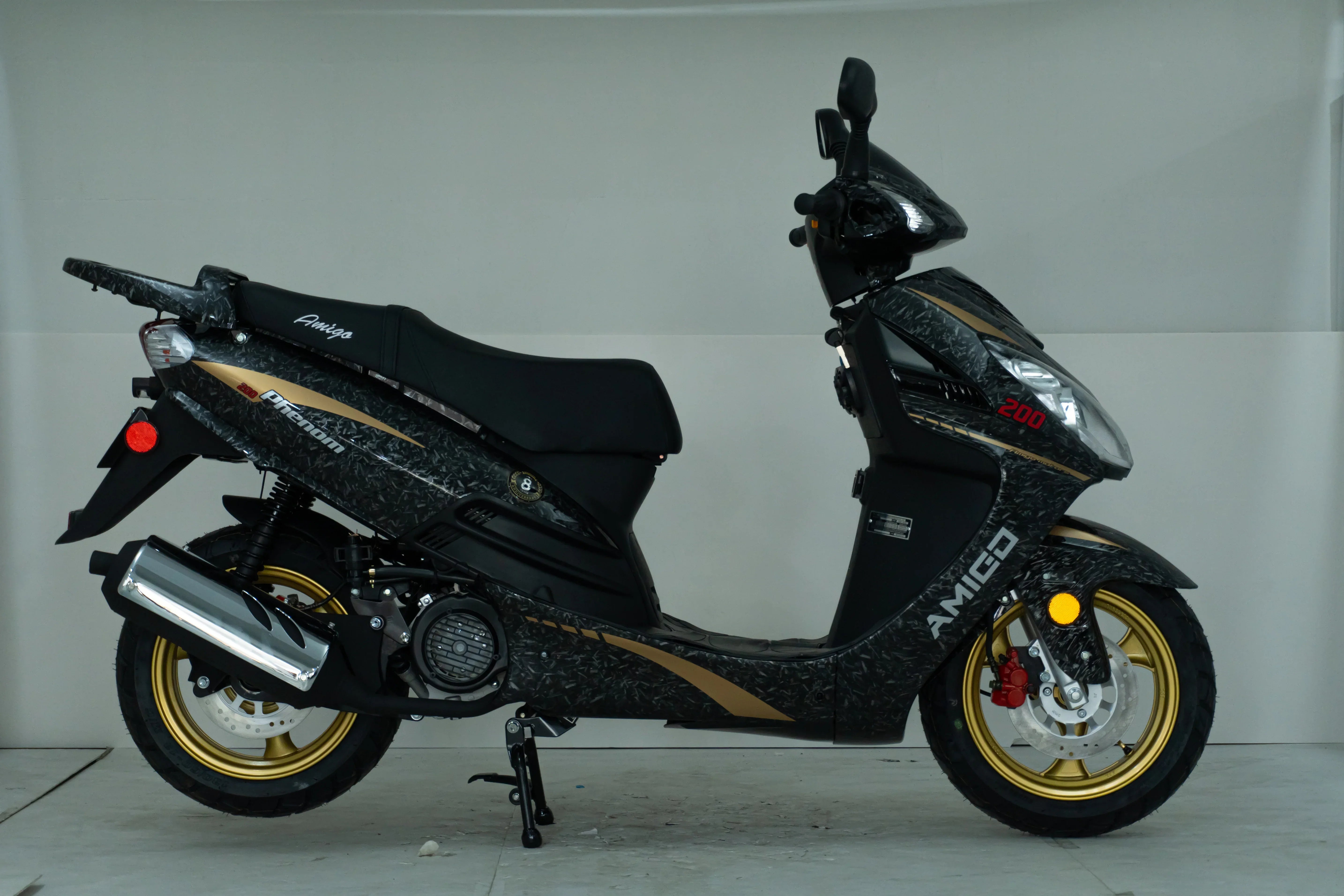 Black and gold Amigo 200cc scooter with sleek design and chrome exhaust