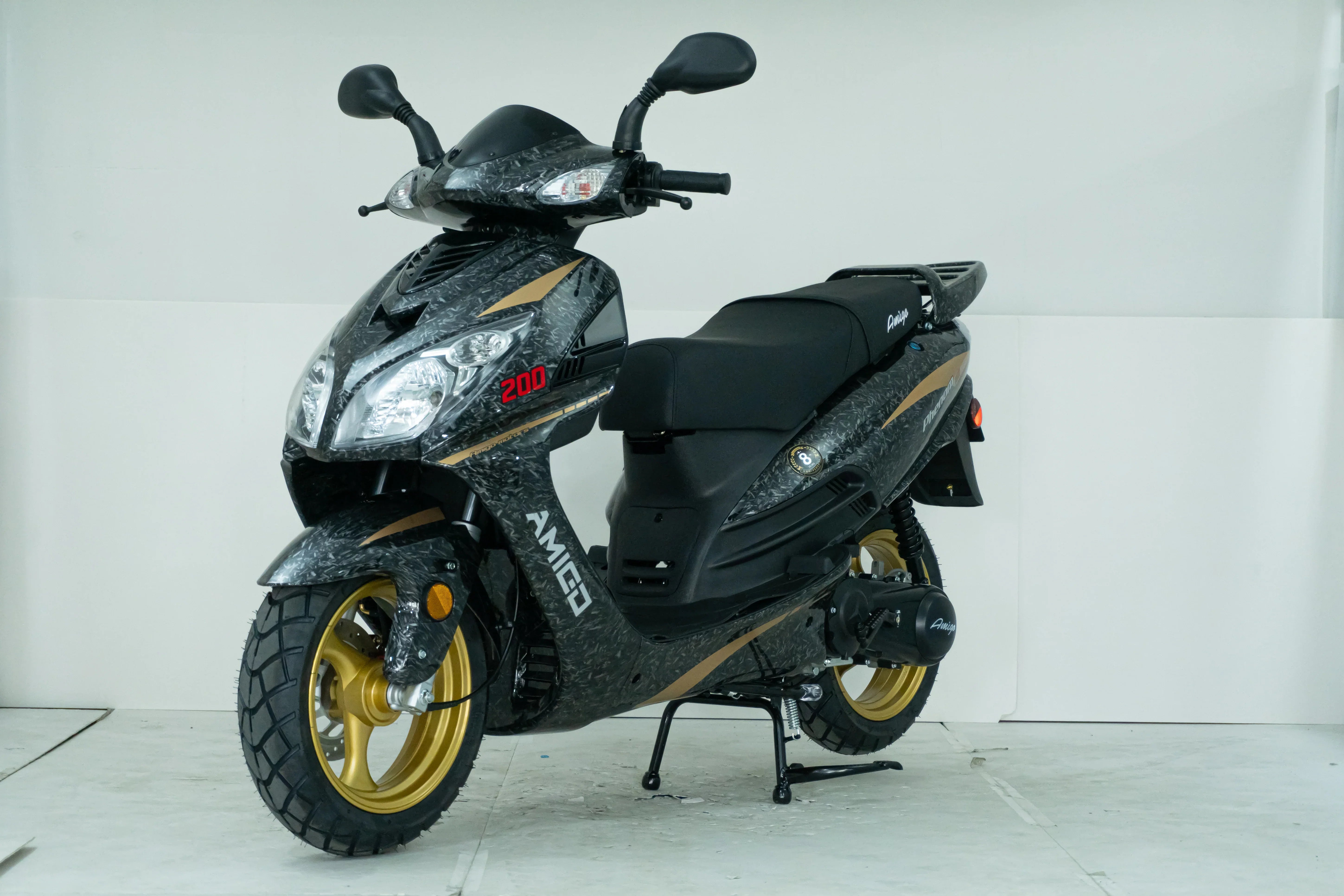 Black and gold Amigo 200cc scooter with rugged tires and sleek design
