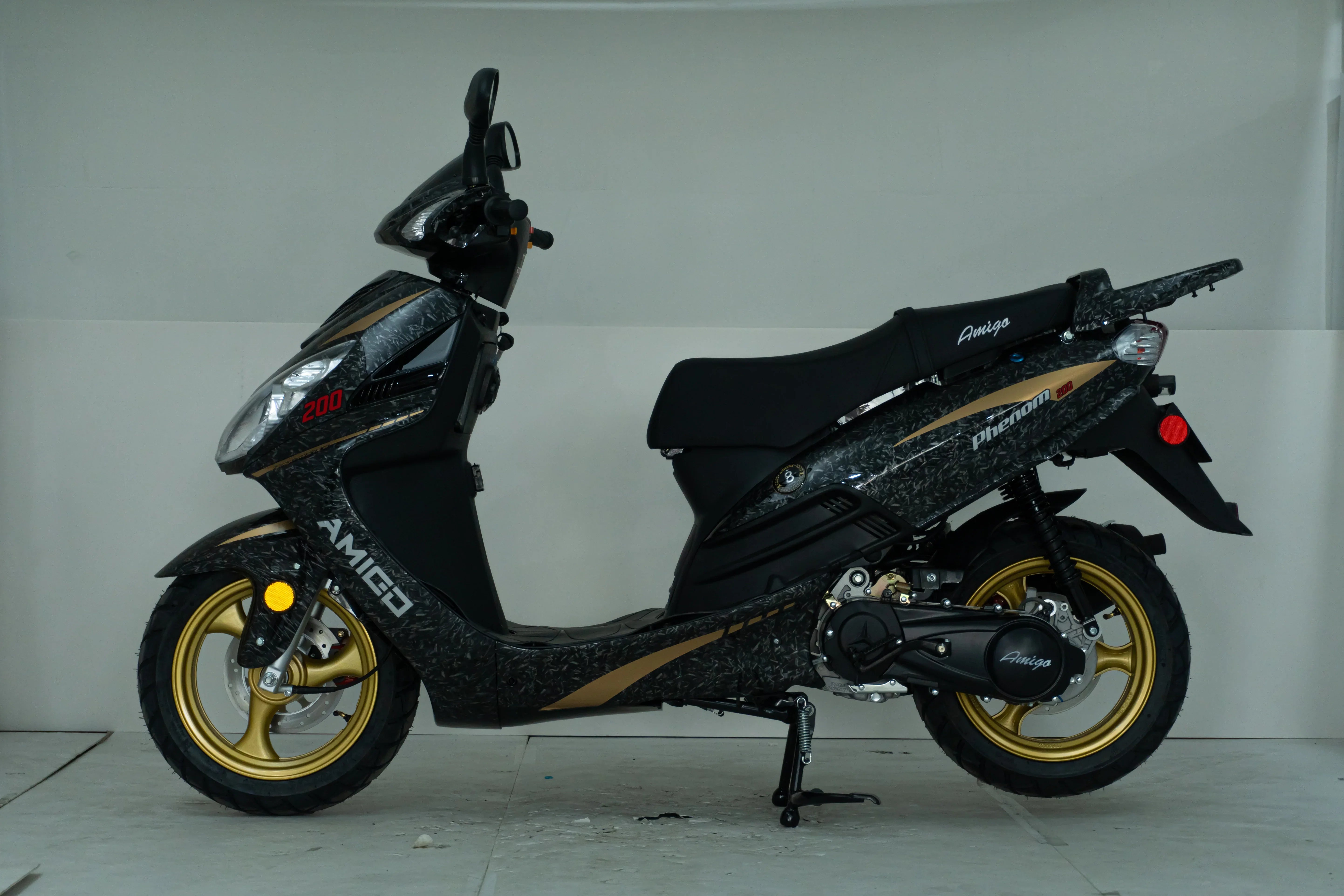 Black and gold Amigo Phenom 200 scooter with sleek design and sporty wheels