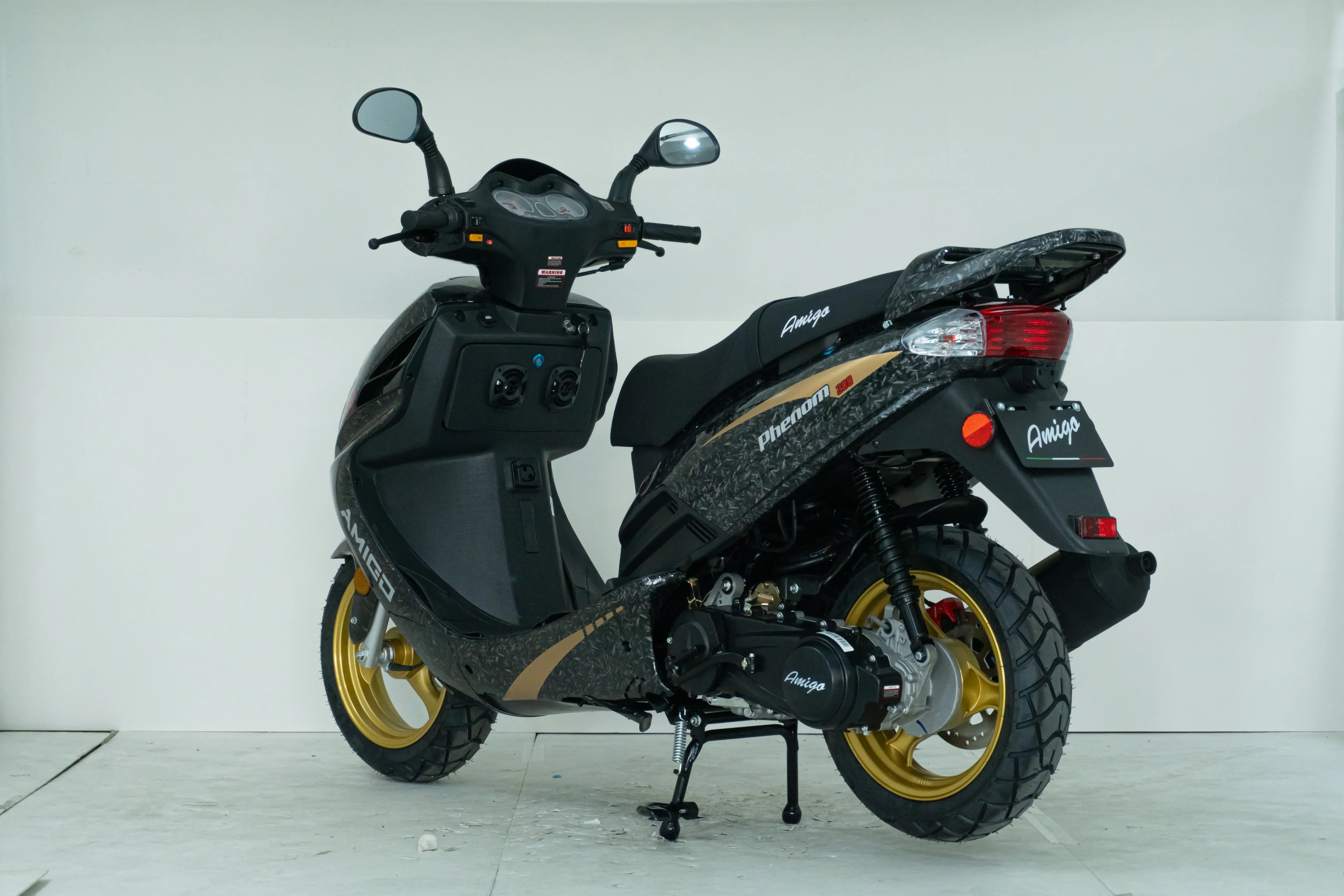 Amigo Phenom 200 scooter with gold rims and black body, ideal for urban commuting.