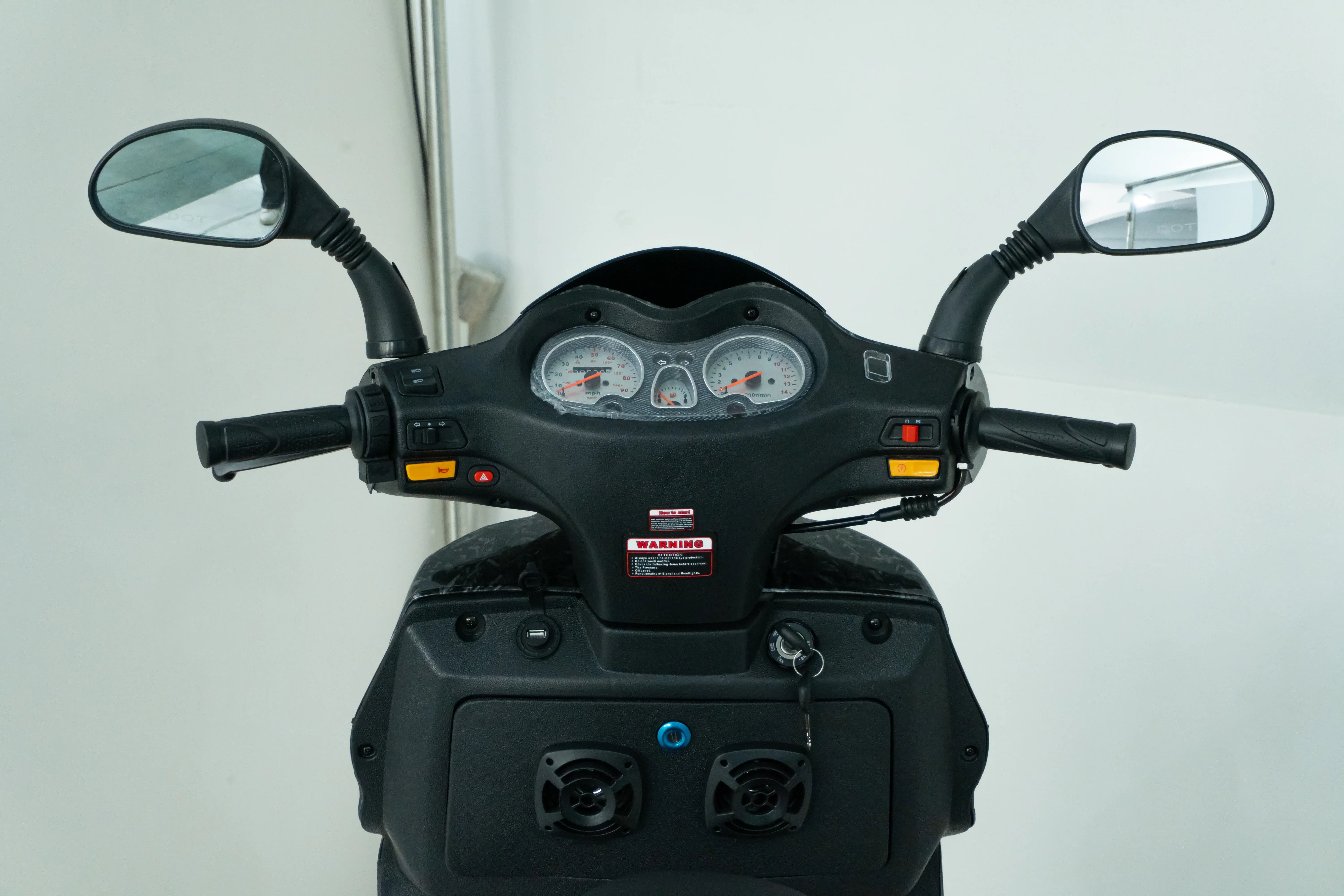 Scooter dashboard with speedometer, mirrors, and control buttons for easy riding