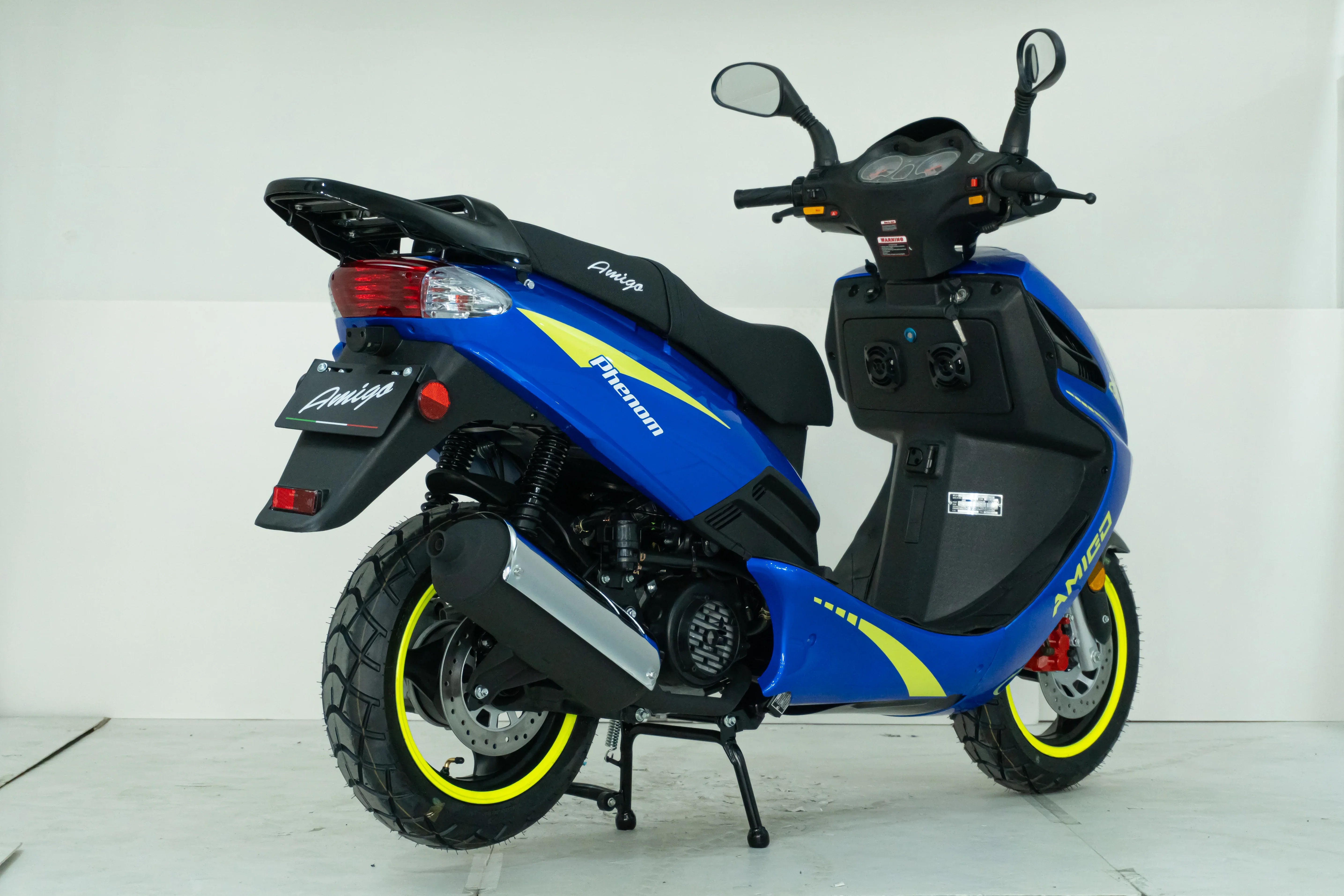 Blue Amigo Phenom scooter with yellow accents and rugged tires, ideal for urban commuting.