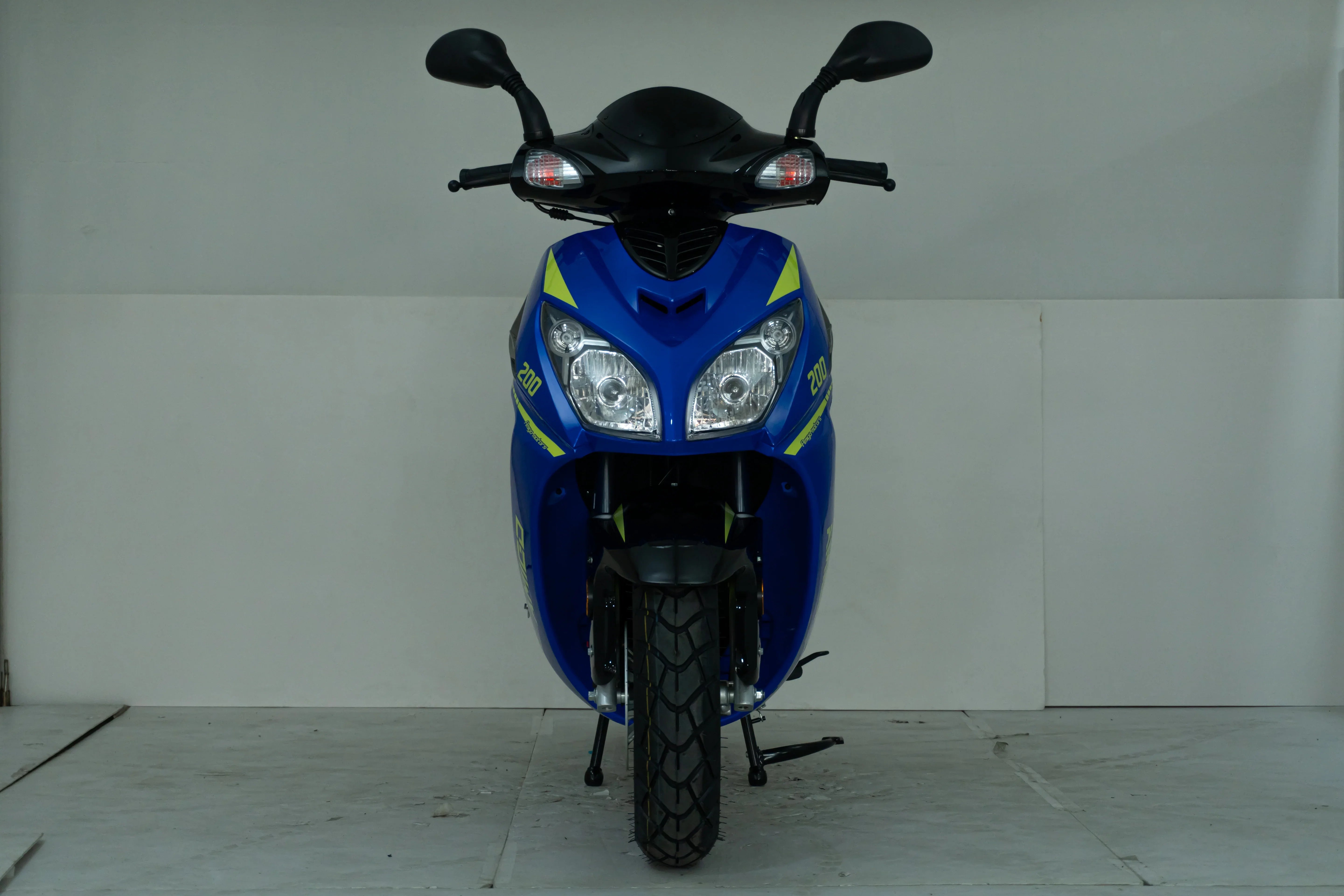 Blue 200cc scooter with dual headlights and yellow accents, ideal for urban commuting.