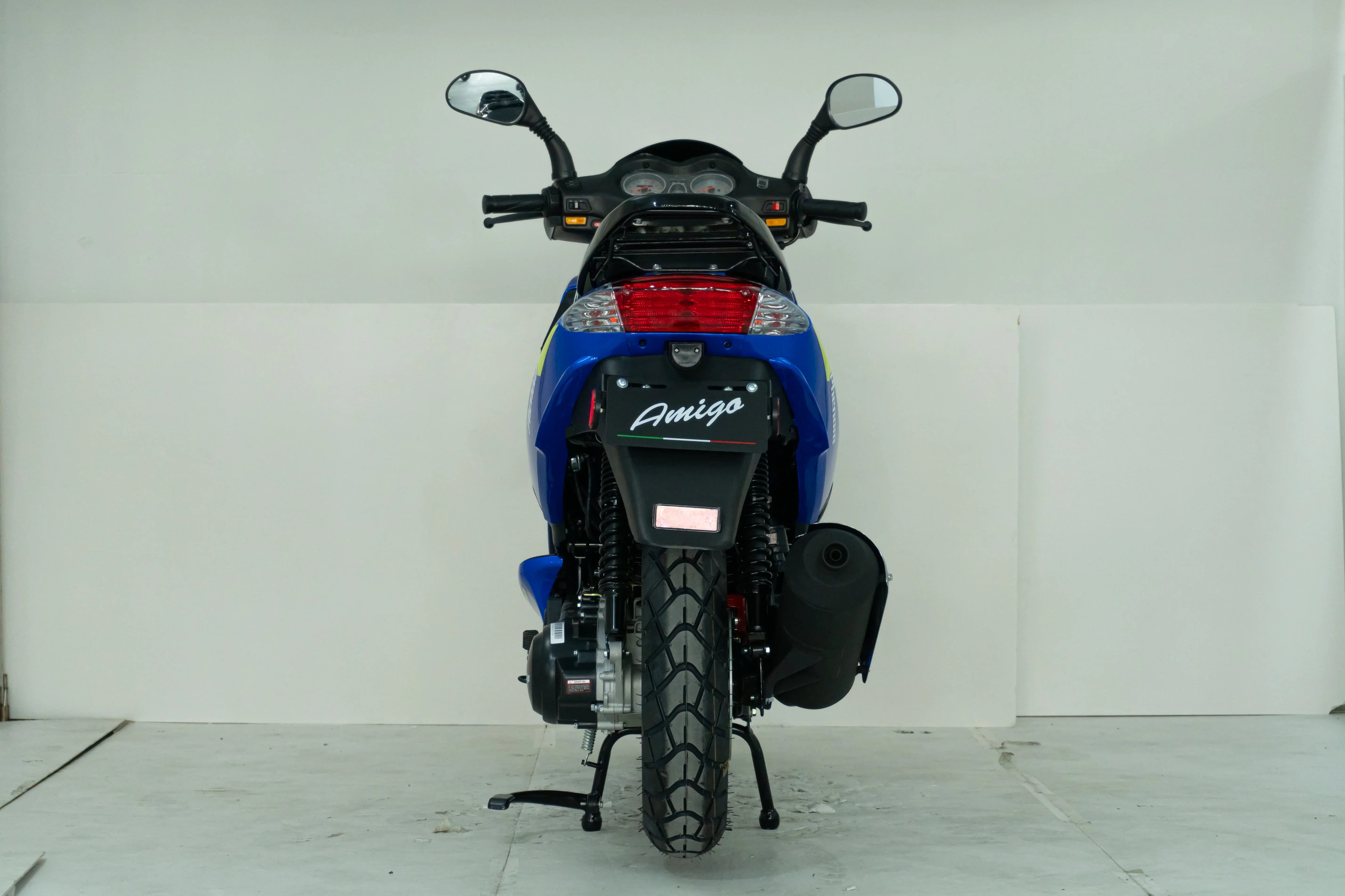 Blue Amigo motorcycle rear view with dual mirrors and taillight, ideal for powersports enthusiasts.