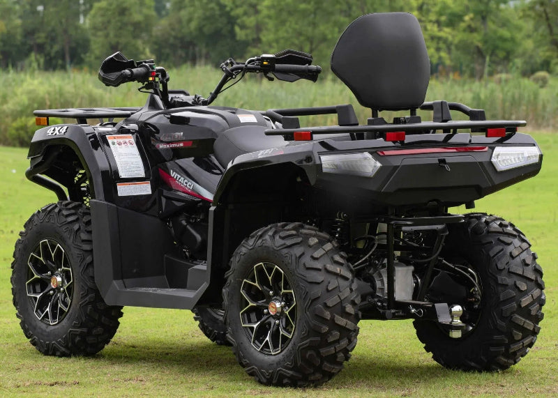 Black Vitacci 4x4 Maximus 450L EFI engine, rugged tires, and rear cargo rack on grass
