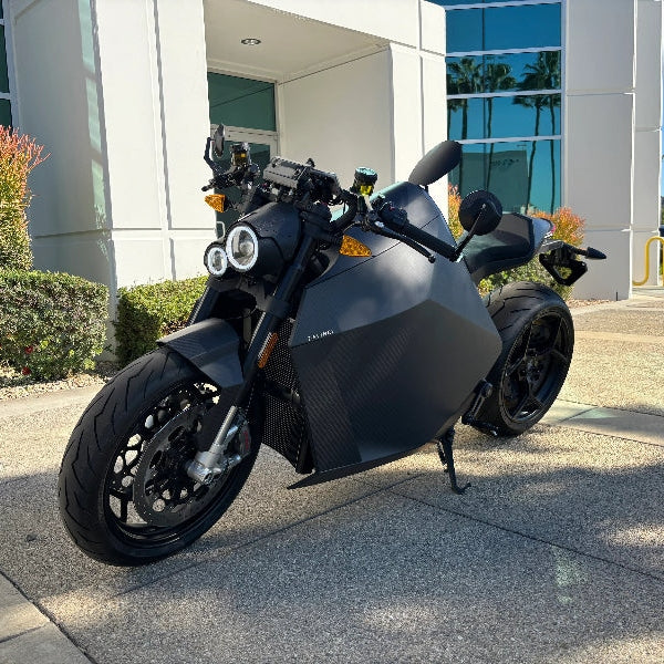DAVINCI DC100 electric motorcycle front view with dual headlights and geometric bodywork