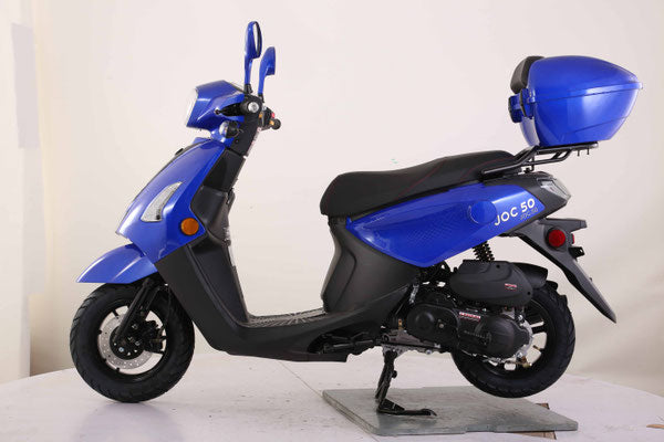 Blue and black scooter on displayed on a blank canvas
