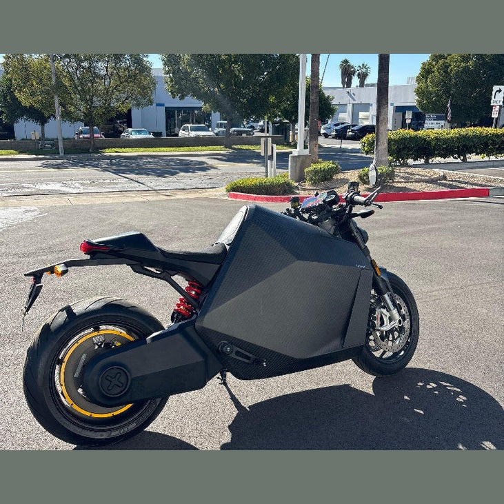 DAVINCI DC100 matte black electric superbike outdoor side profile with disc brakes