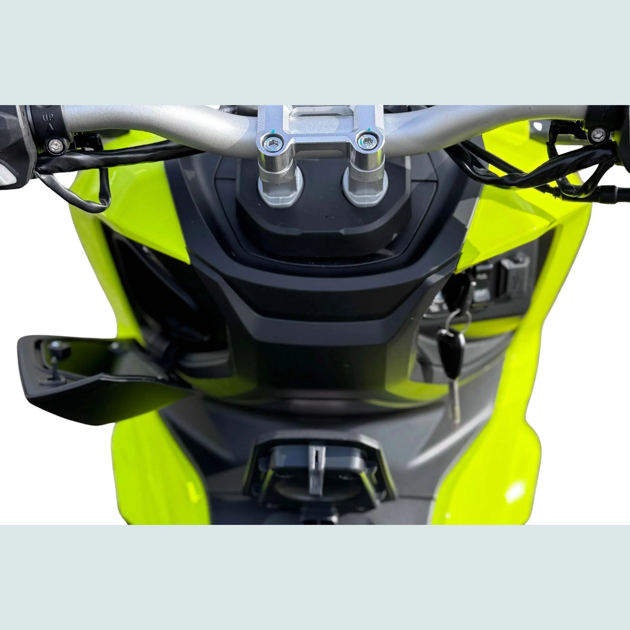 Lime green Amigo 200 scooter handlebar area with silver stem and storage compartment