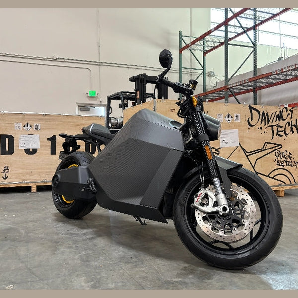 DAVINCI DC100 matte black electric superbike side profile with carbon fiber fairing