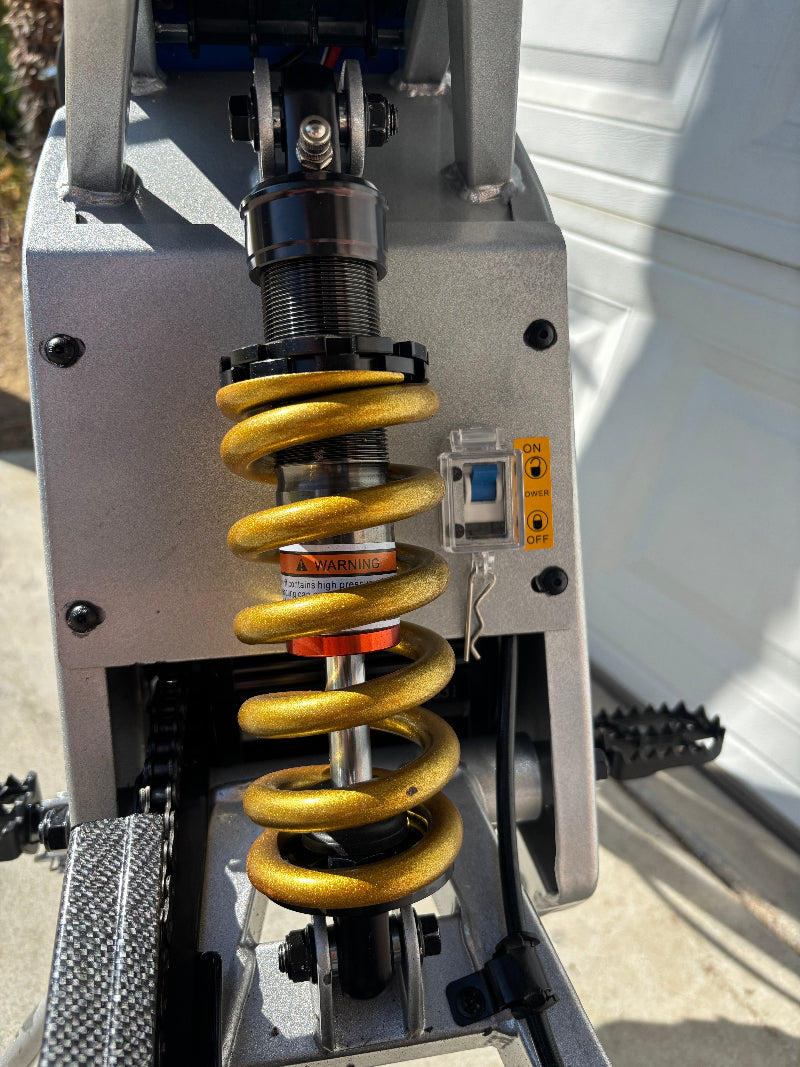 Close-up of a hoverhearts dirt bike rear shock.