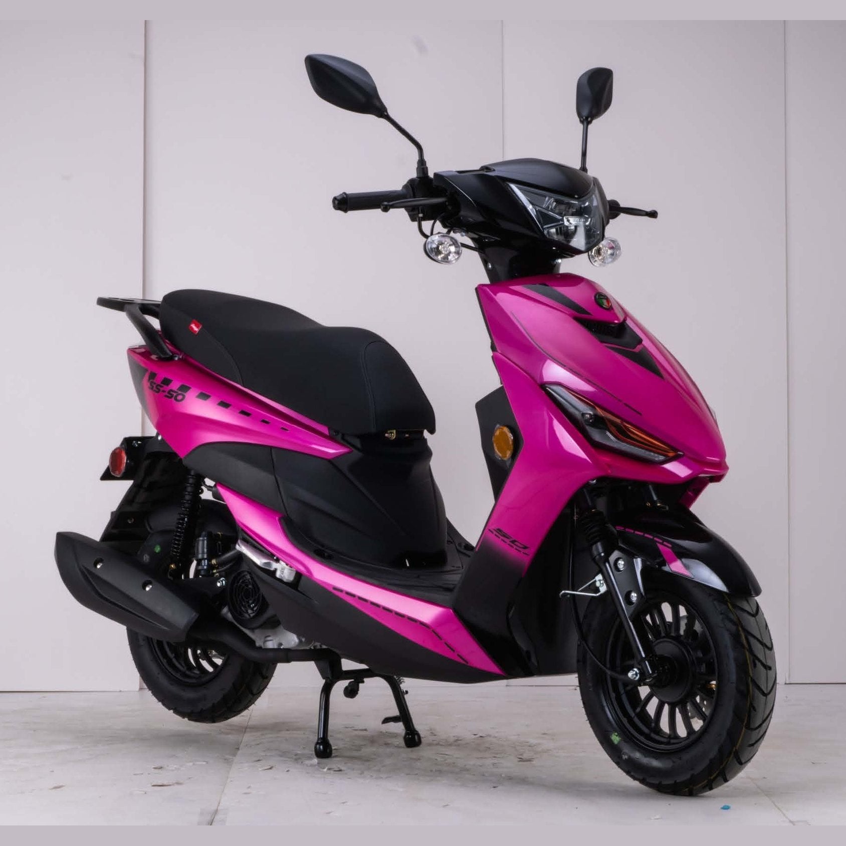 Pink and black Amigo SS-200 automatic scooter front three-quarter view