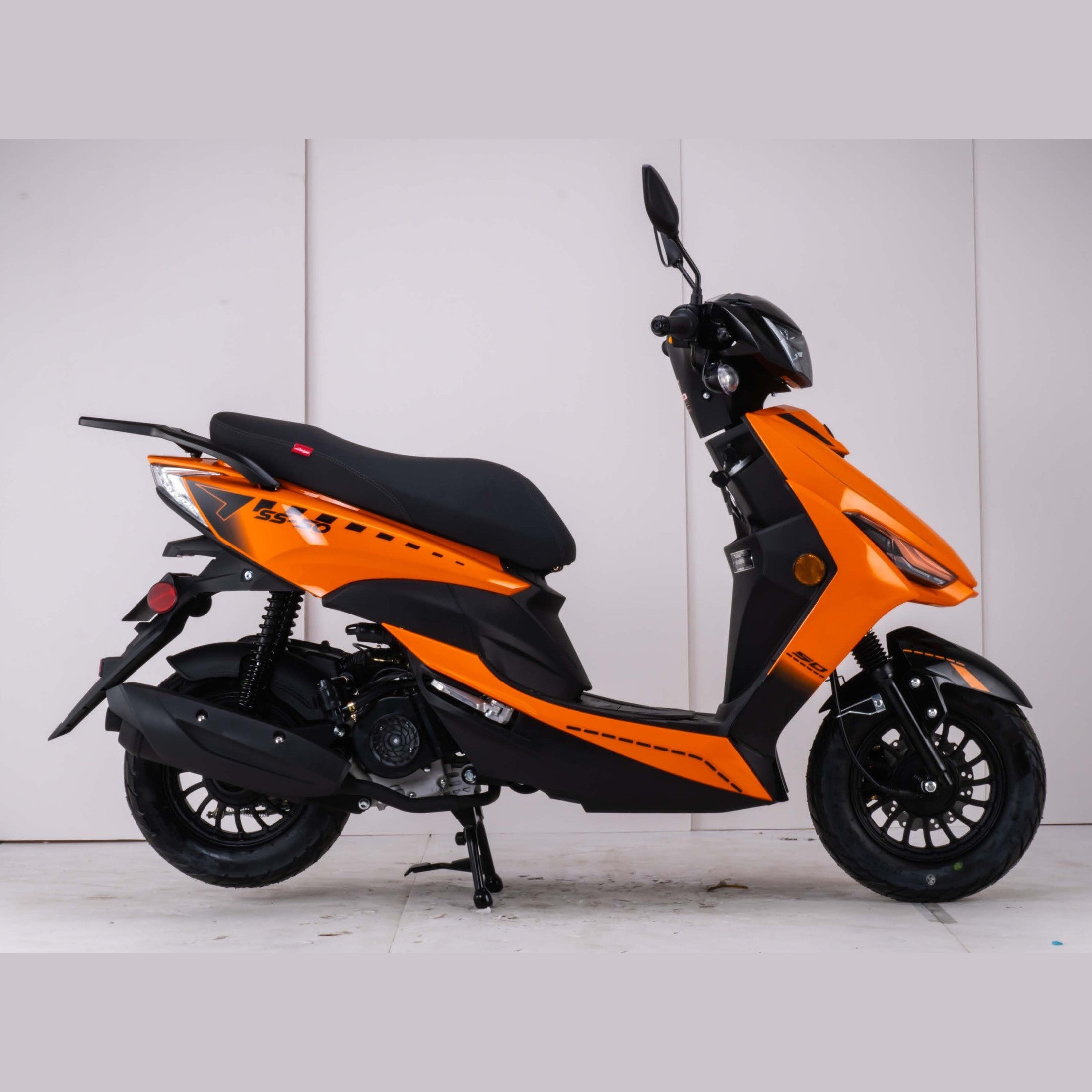 Bright orange Amigo SS-200 scooter side profile with padded seat and suspension