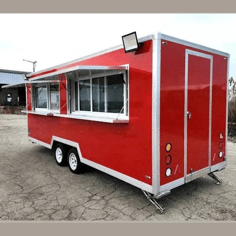 Red and silver fully loaded food concession trailer with sliding service window, dual axles, and exterior lighting