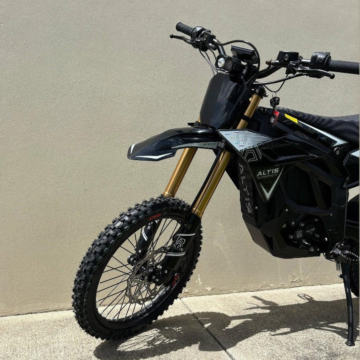 side view of black Atlis Sigma electric dirt bike featuring white graphics and disc brakes