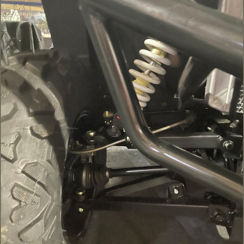 Close-up white coil spring shock absorber on Bighorn Explorer 550 UTV