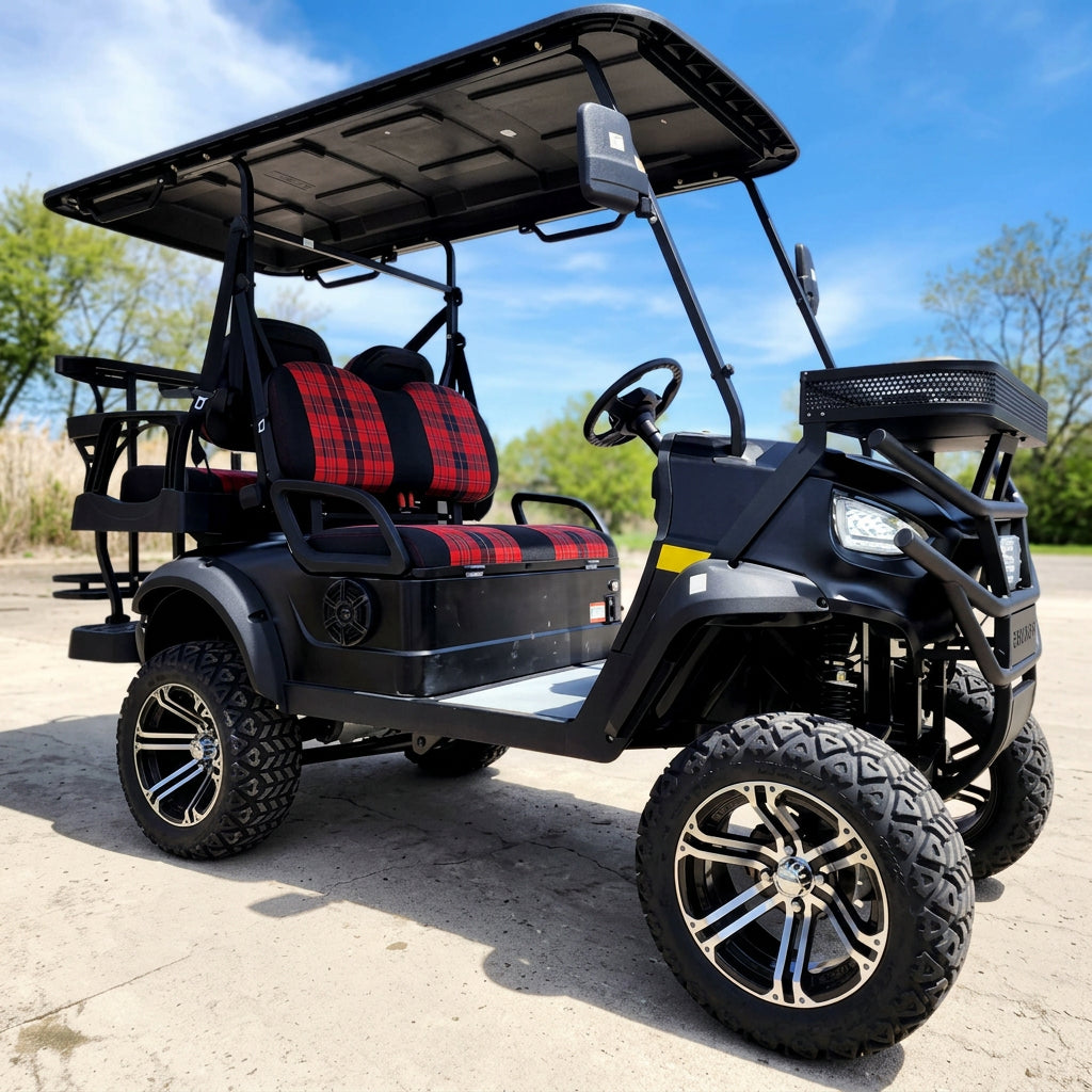 Black Renegade+ electric golf cart with grille guard and patterned seat covers