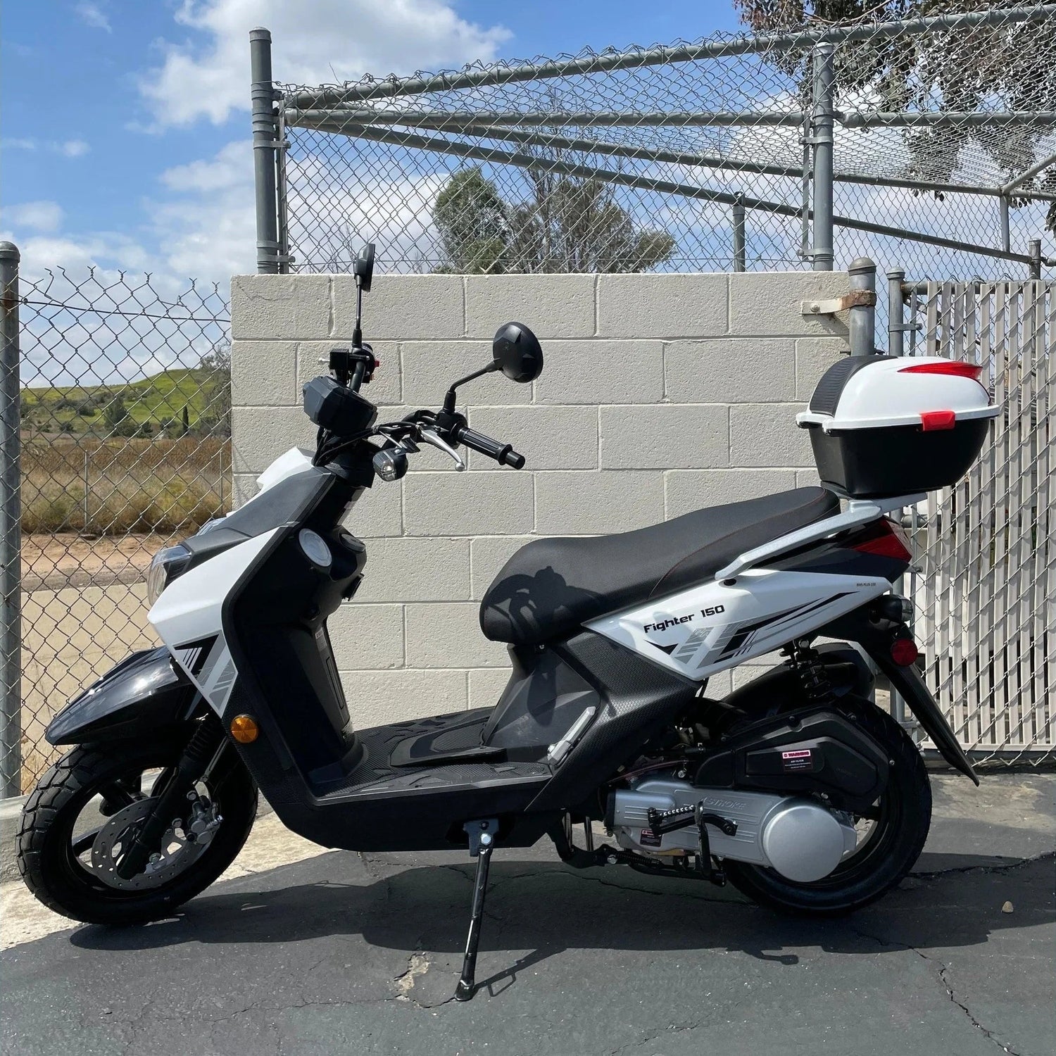 Black and white Ranger 150cc scooter side profile with engine