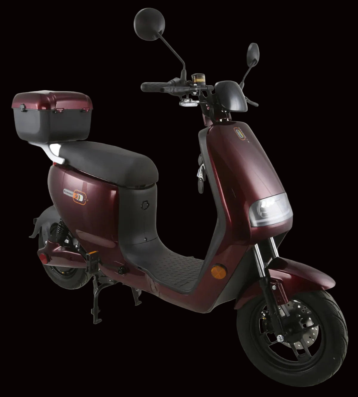 A maroon-colored Vitacci E-RUNNER electric scooter with a black seat, front disc brake, rear drum brake, and a storage compartment at the back.