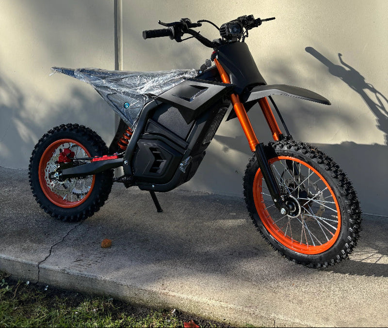 Cemoto electric off-road dirt bike on a concrete surface 
