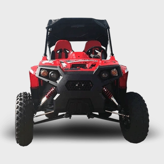 Front view of red TrailMaster UTV highlighting grille, headlights, and coil-over shocks