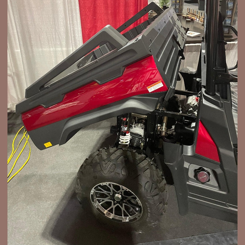 Red and black Bighorn Explorer 550 UTV side view raised cargo bed