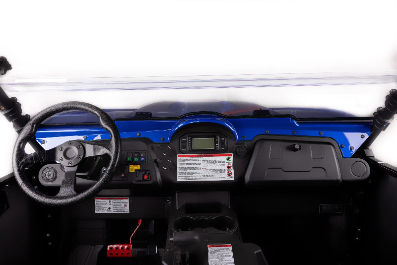 Close-up of a vehicle's dashboard with steering wheel and controls.