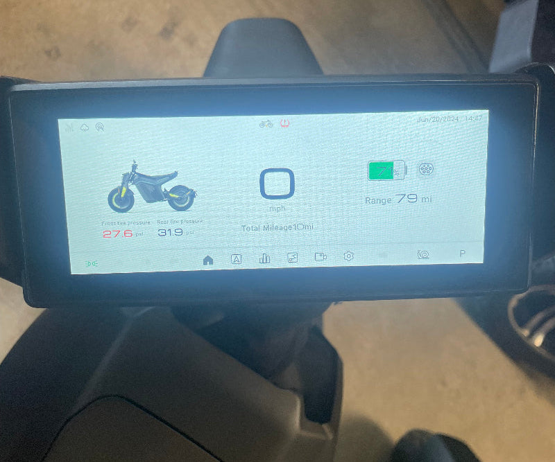 Electric IAM motorcycle digital dashboard showing tire pressure, battery 71%, speed 0 mph, and 79 mile range