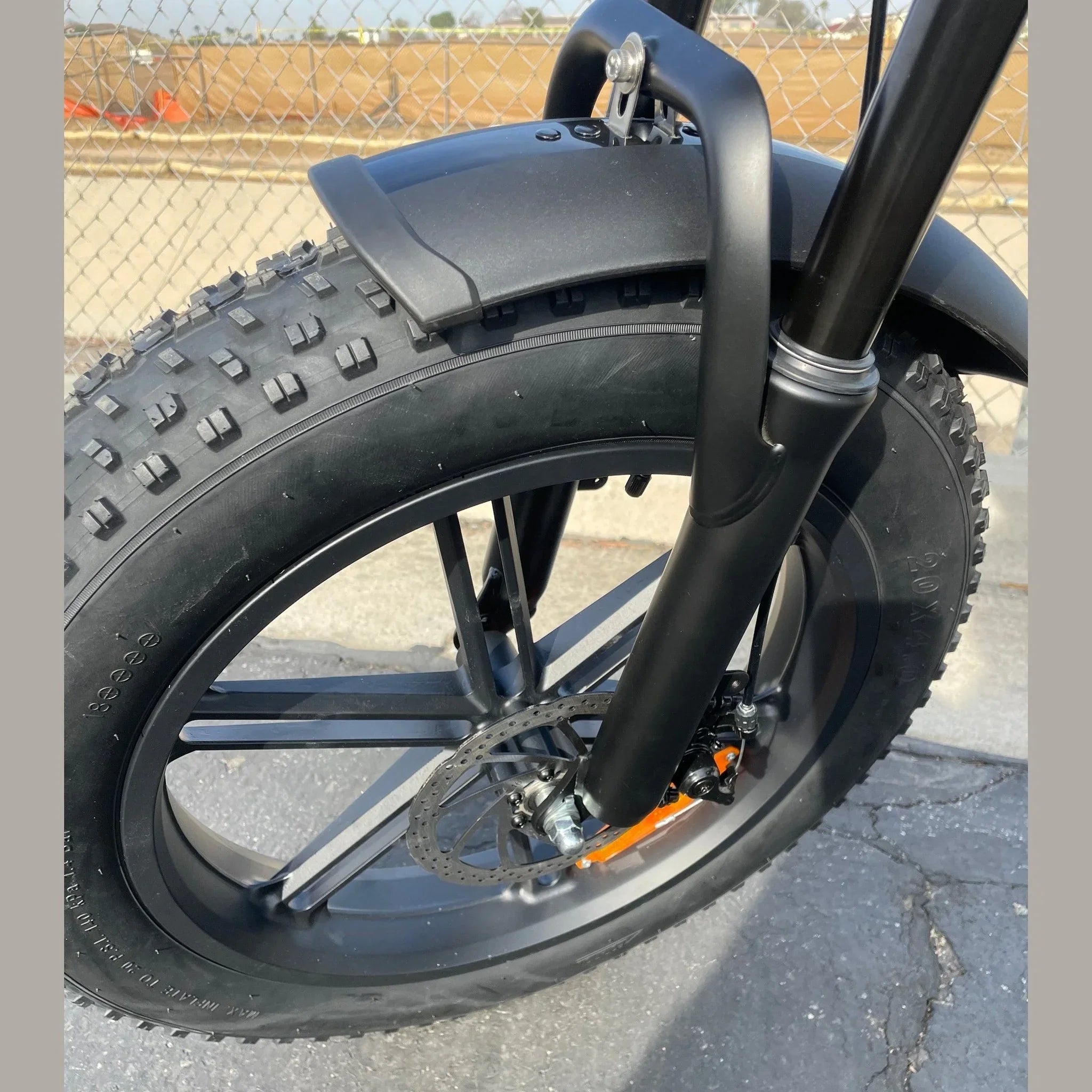 Close-up of 20x4.0 inch fat tire and disc brake on G50 bike