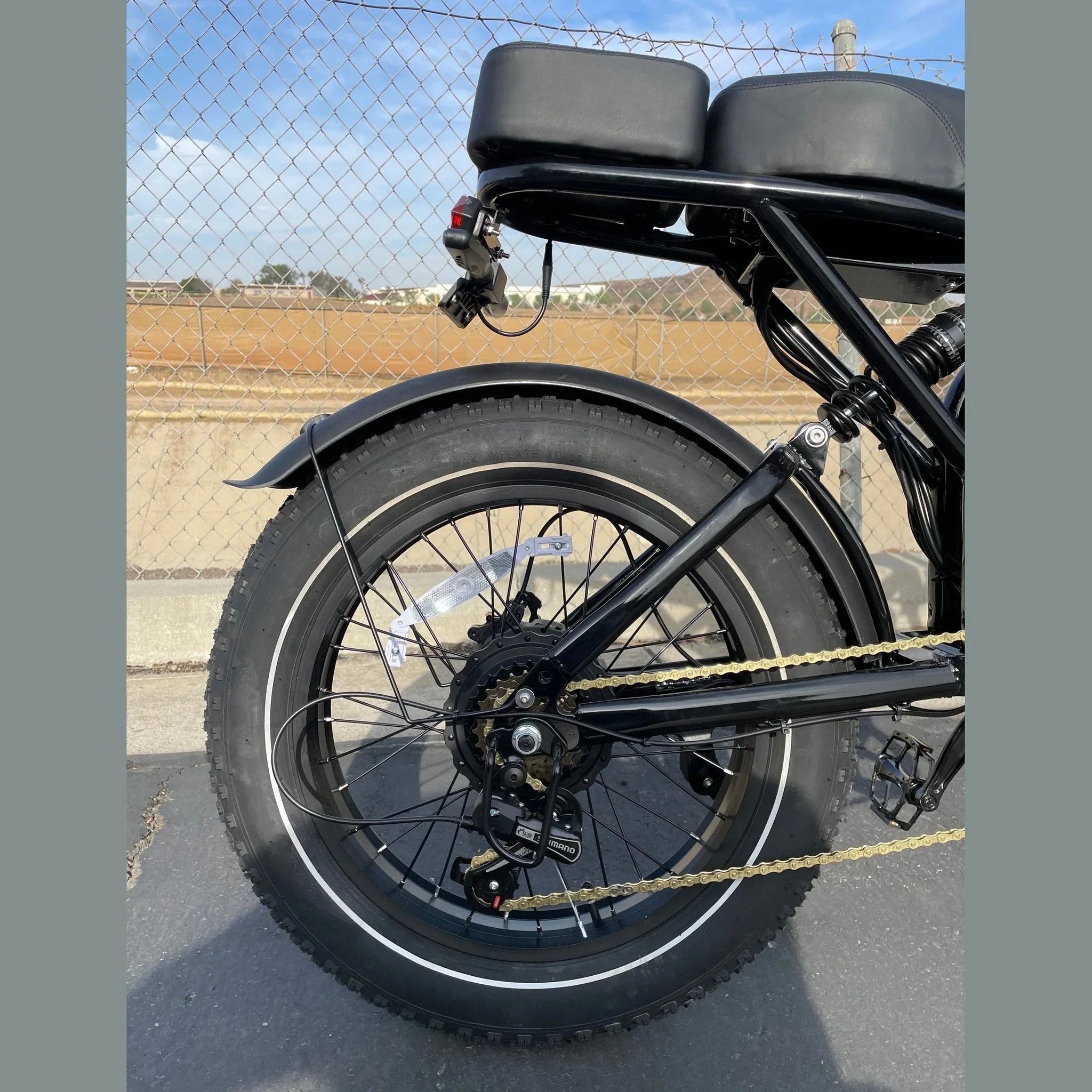 Black HappyRun G70 e-bike rear view with Shimano gears and fat tires
