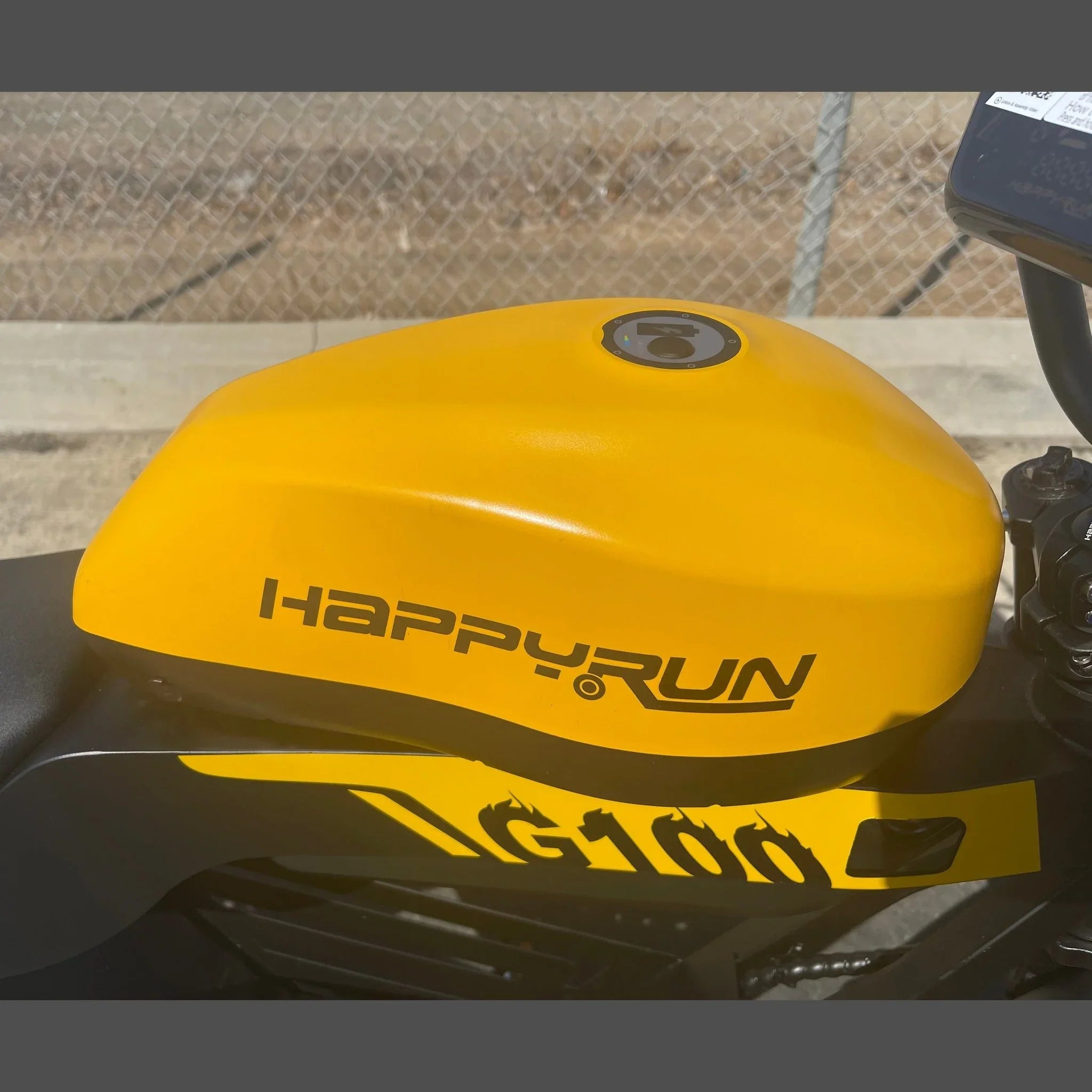 Yellow Happyrun Tank G100 electric bike battery cover detail with black lettering