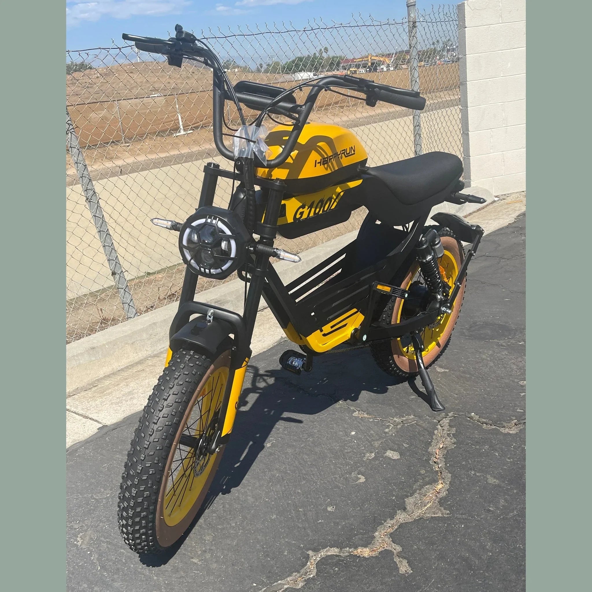 Happyrun Tank G100 yellow electric bike side profile on asphalt