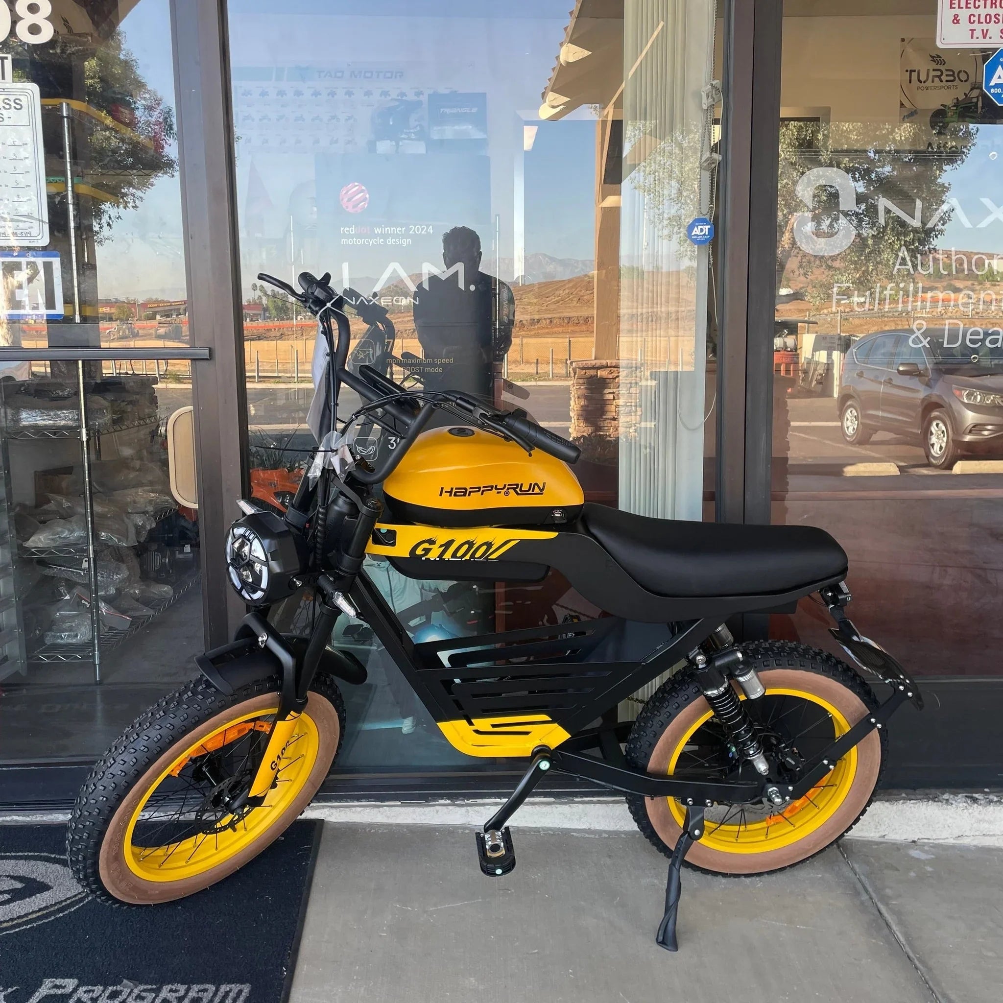 Yellow and black Happyrun Tank G100 electric bike front view with fat tires