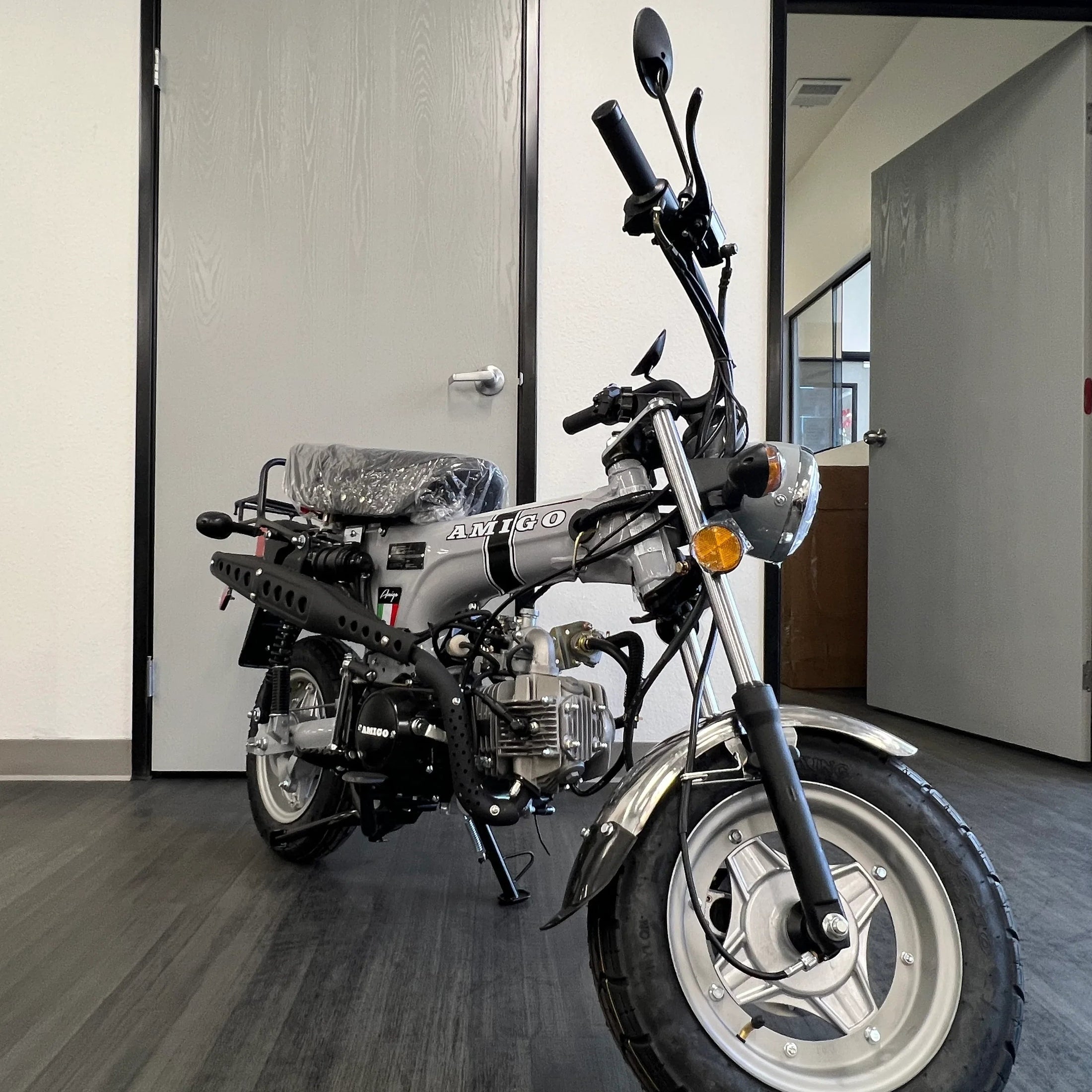 Silver Amigo Rocky 125cc mini motorcycle with black accents and exposed air-cooled engine