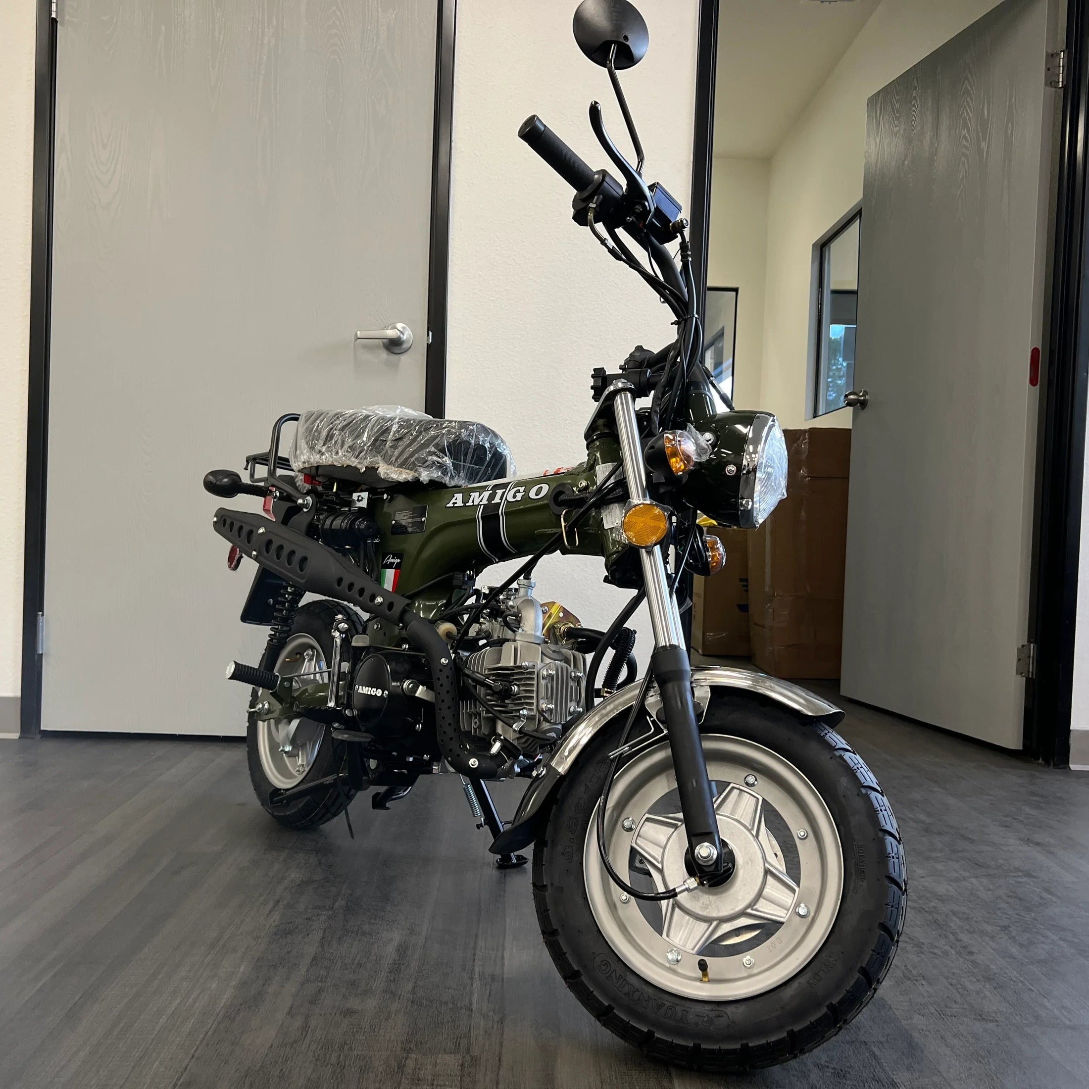 Olive green Amigo Rocky 125cc mini motorcycle angled view with chrome fender
