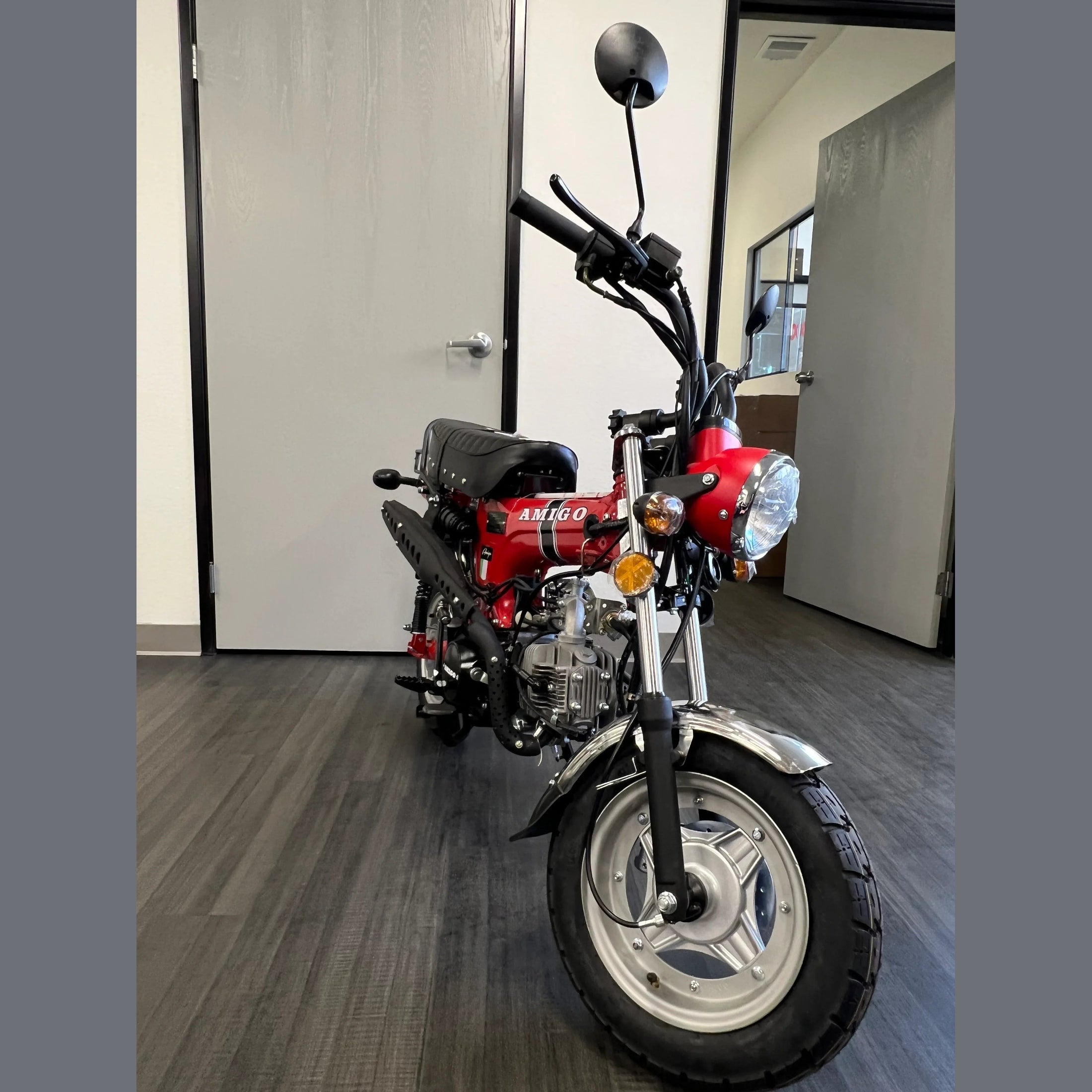 Red Amigo Rocky 125cc mini motorcycle with black stripe and quilted seat detail
