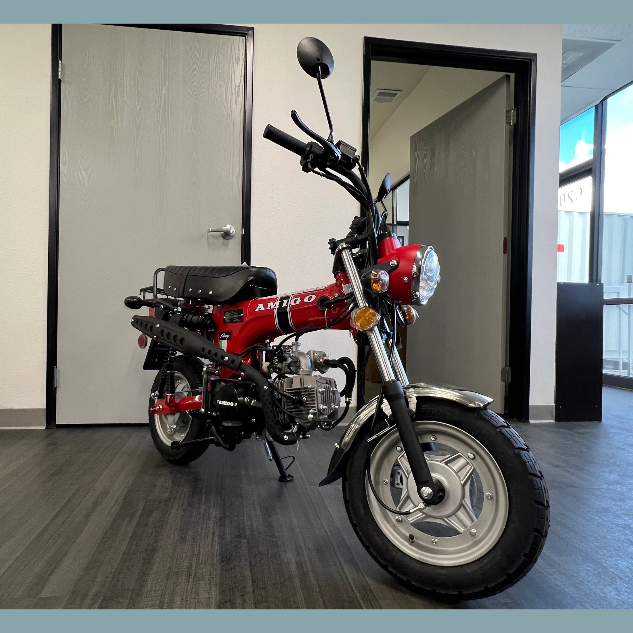 Red Amigo Rocky 125cc mini motorcycle with script logo and coil spring suspension