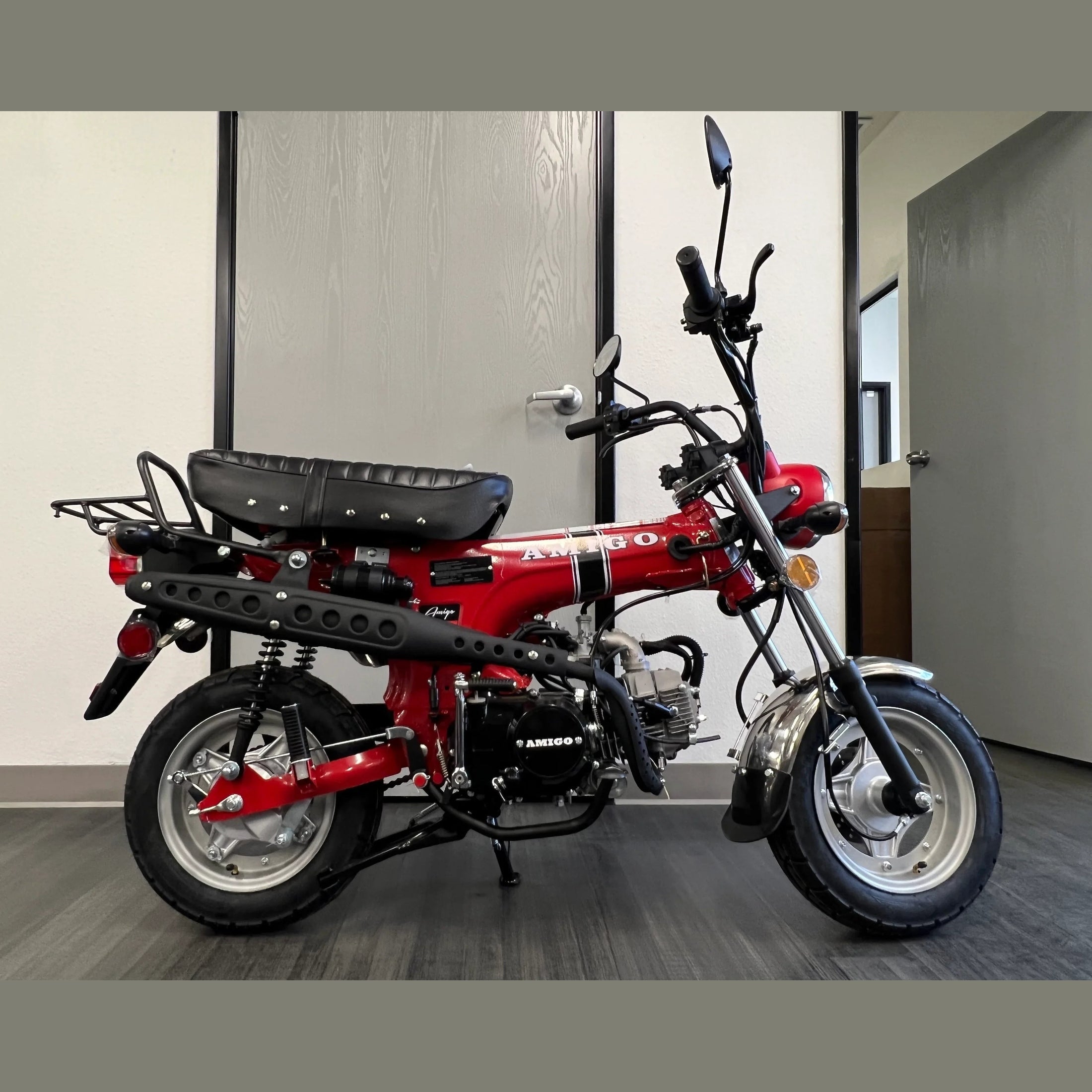 Red Amigo Rocky 125cc mini motorcycle side profile with rivet-stitched seat