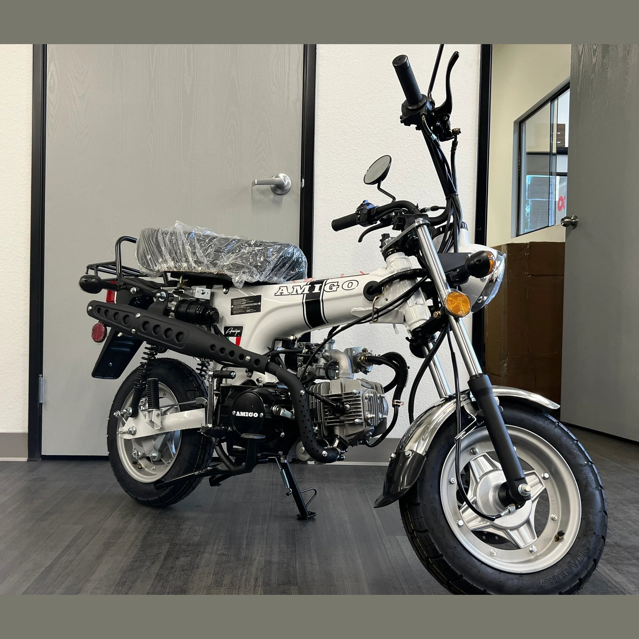 White Amigo Rocky 125cc mini bike front view with chain drive and cooling fins