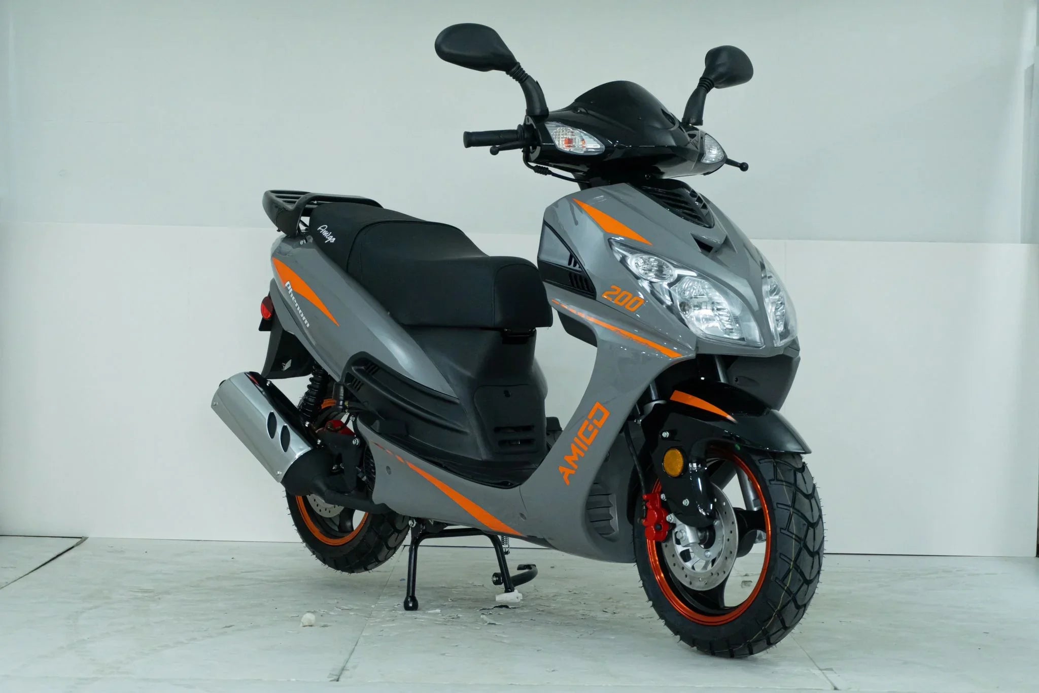 Gray and orange Amigo 200cc scooter with rugged tires and disc brakes, ideal for urban commuting.