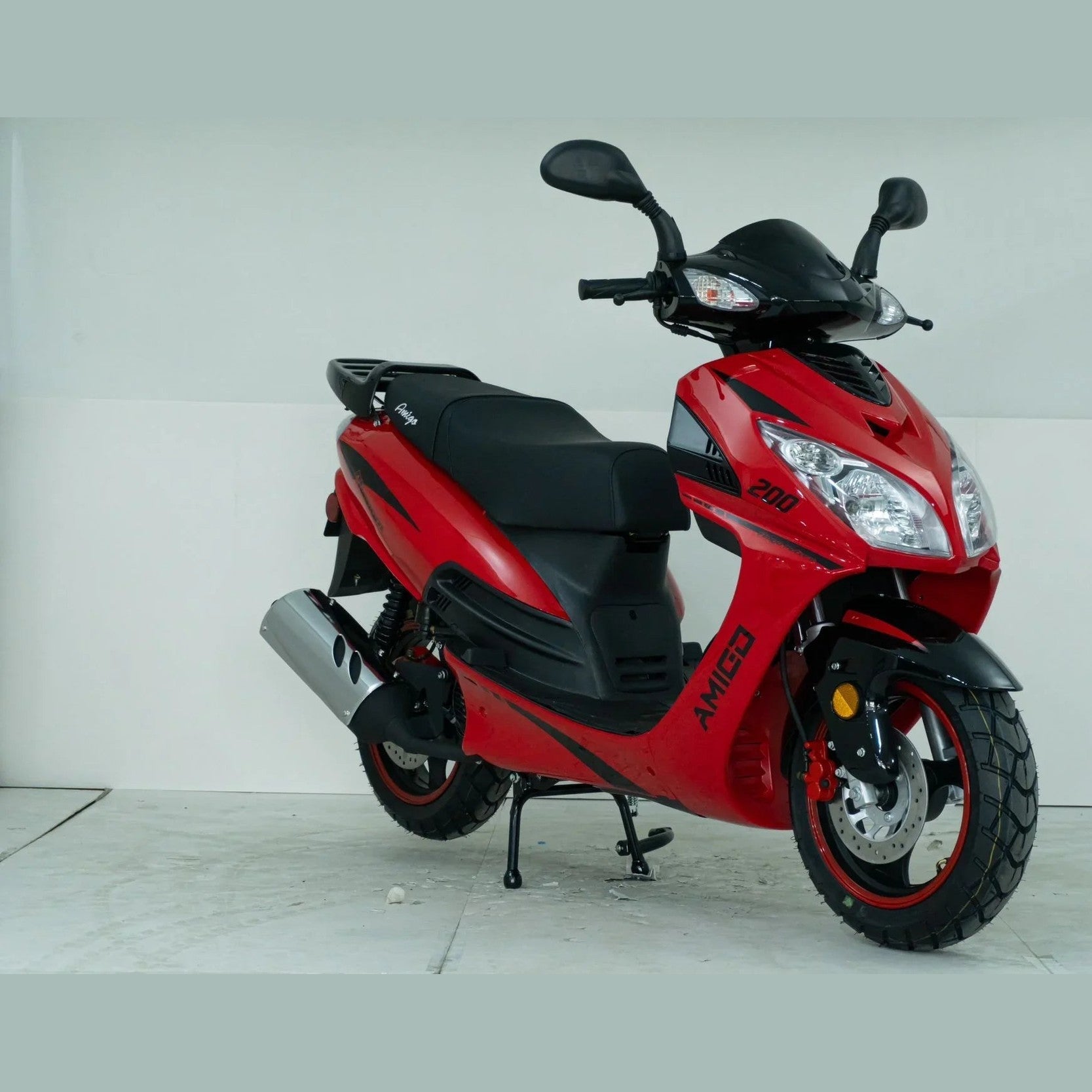 Red Amigo 200cc scooter with black seat and sporty design in a studio setting