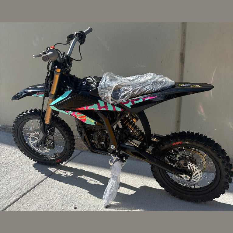 Black Surron Hyper Bee electric dirt bike teal pink accents new