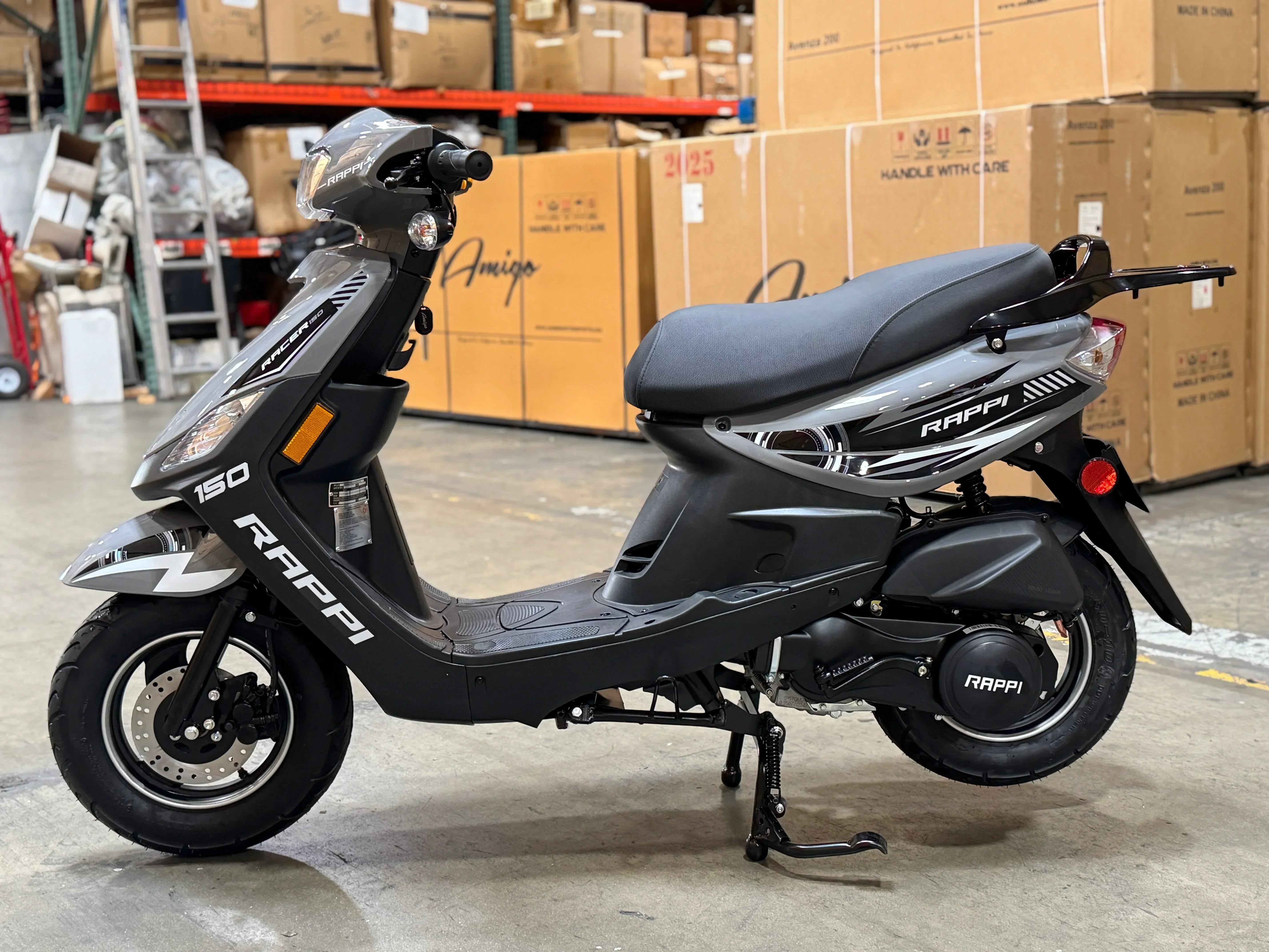 Rappi 150cc scooter in warehouse, sleek black design with disc brakes and comfortable seat