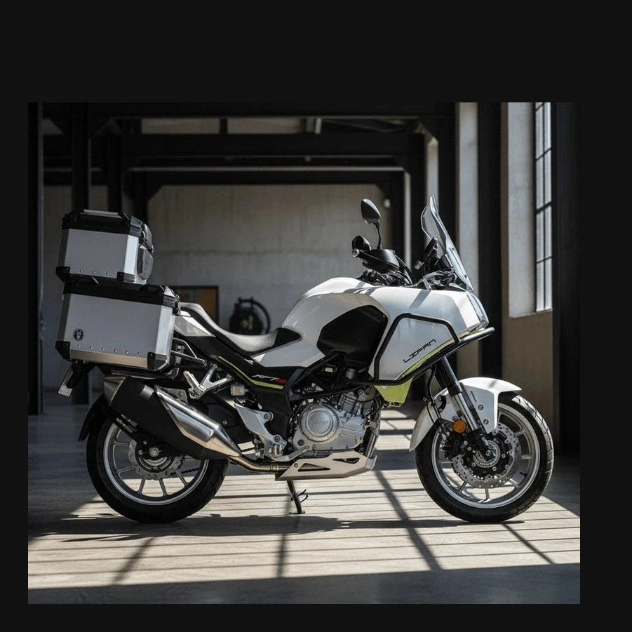 White and black Lifan KPT 400 adventure motorcycle with silver panniers, top case, windscreen, and spoked wheels
