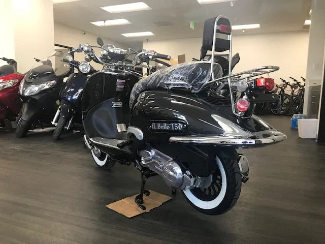 Black Il Bello 150cc scooter with chrome trim and whitewall tires on showroom floor